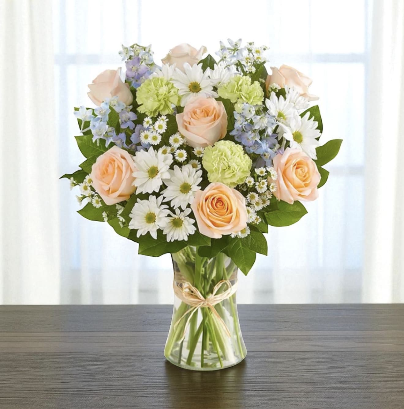 Cotton Candy Sunsets Cotton Candy Sunsets - Peach roses, sweet blue delphinium white daisy and green carnations sure to make your loved one smile.