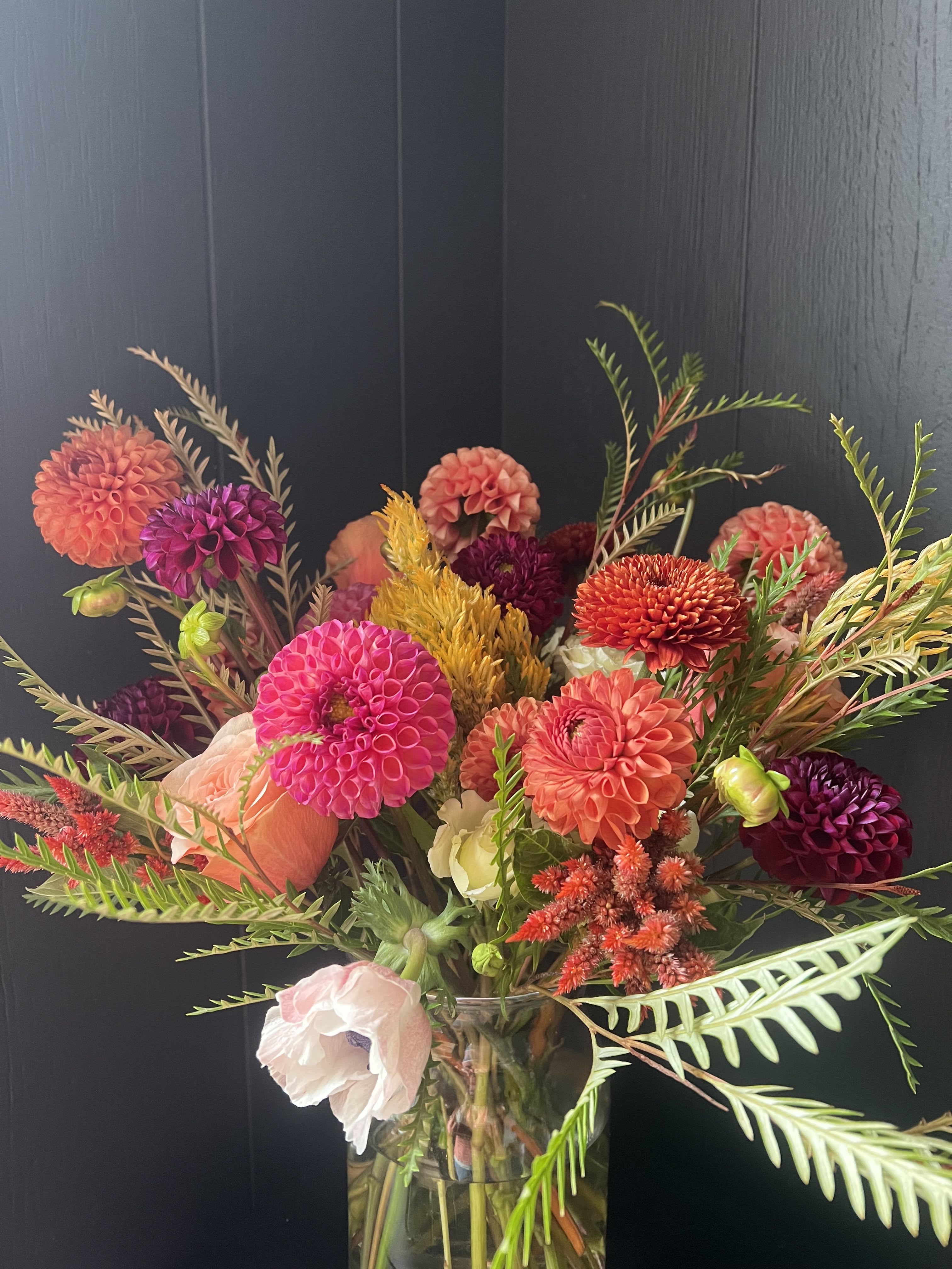 LARGE SEASONAL ARRANGEMENT IN GLASS VASE, DESIGNER'S CHOICE - Seasonal, colorful flowers and foliage artfully arranged in a clear glass vase.  Year round flowers that we typically stock: specialty rose, spray rose and garden rose, ranunculus, anemone, gerbera daisy, protea, lisianthus, chrysanthemum, larkspur, snapdragon, delphinium, stock, aster, dianthus, hypericum, feverfew, astrantia, leucodendron.