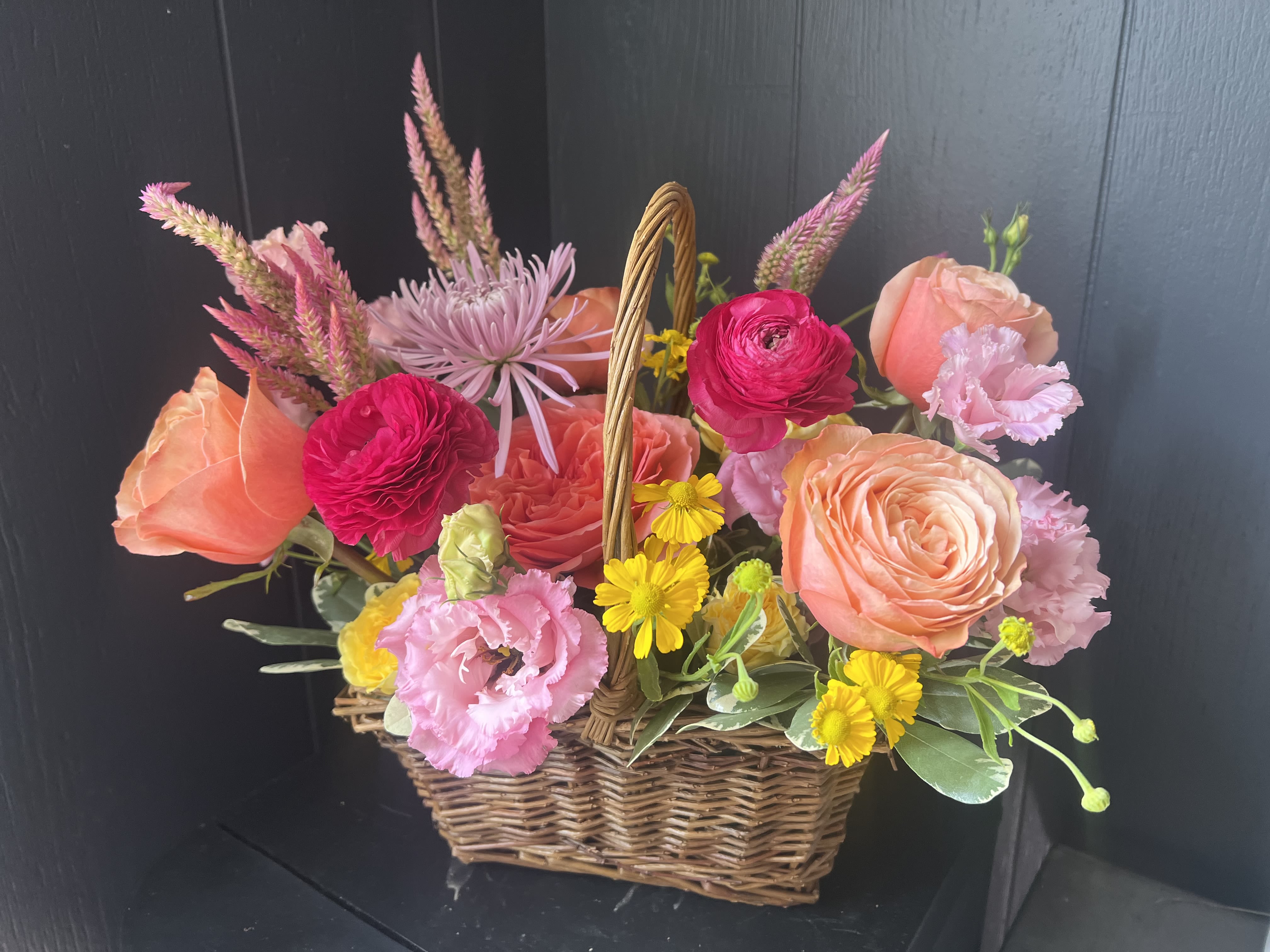 SEASONAL BASKET  - Seasonal, colorful flowers and foliage artfully arranged in a rectangular woven basket.  Year round flowers that we typically stock: specialty rose, spray rose and garden rose, ranunculus, anemone, gerbera daisy, protea, lisianthus, chrysanthemum, larkspur, snapdragon, delphinium, stock, aster, dianthus, hypericum, feverfew, astrantia, leucodendron