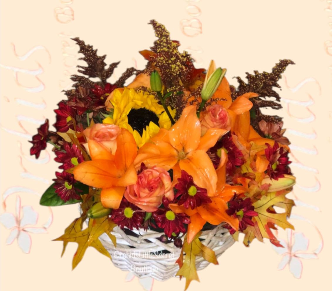 Lily Sunflowers Roses Fall Flower Basket -  Brighten someone's day with this fall basket of fresh orange Asiatic lilies steal the show with their bold beauty, accented by sunny sunflowers, cheerful red daisies, orange roses, and golden solidago for a rich seasonal look. It’s a perfect gift for fall birthdays, Thanksgiving, or simply to brighten someone's day. 