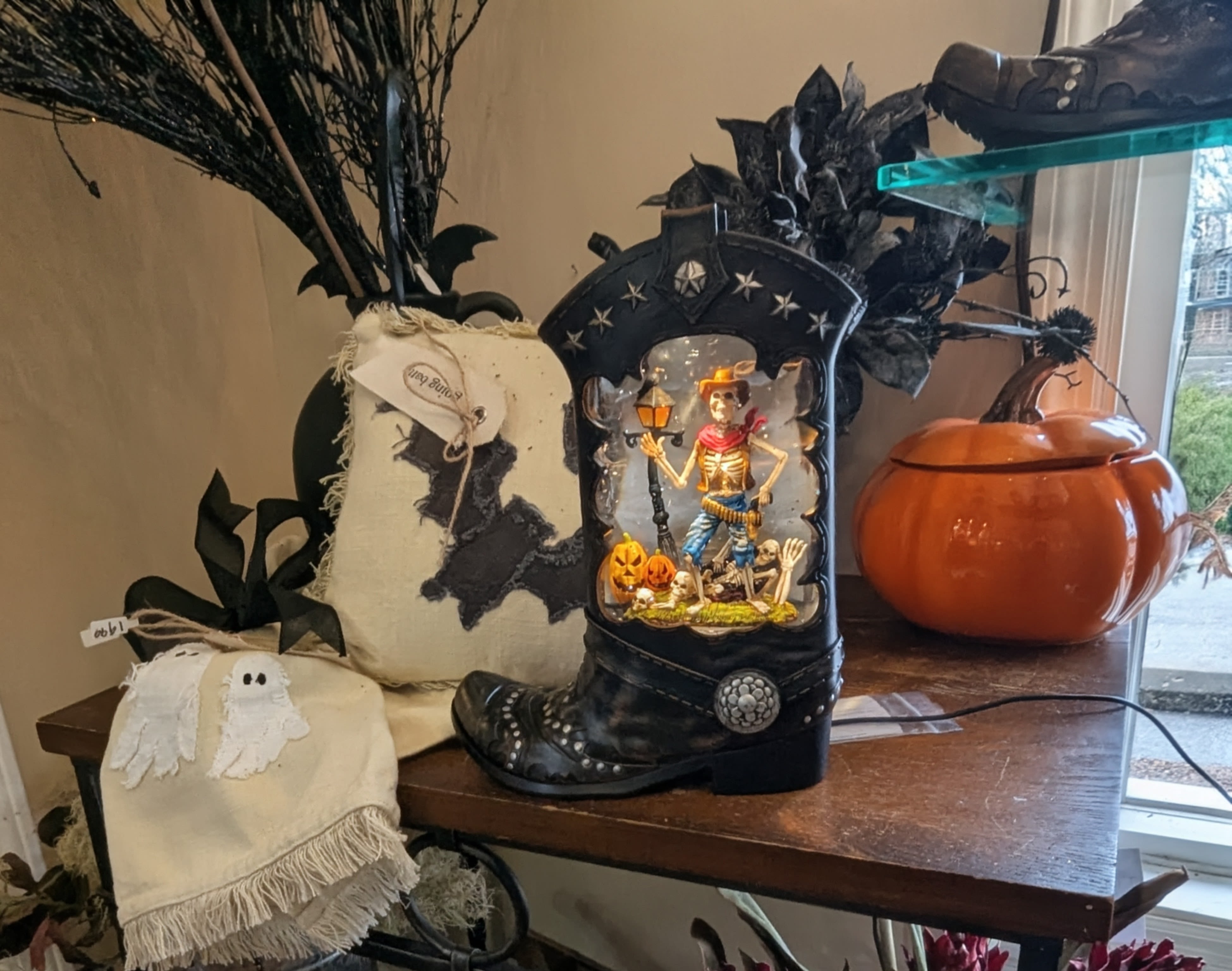 SALE Spooky Cowboy Boot Halloween Water Globe SALE Spooky Cowboy Boot Halloween Water Globe - Step into the eerie Wild West with our Spooky Cowboy Boot Halloween Water Globe! This unique decorative piece showcases a hauntingly charming scene inside a black cowboy boot. Peer inside to find a cowboy skeleton surrounded by festive pumpkins, all set in a chillingly delightful landscape. Perfect for adding a touch of spooky sparkling flair to your Halloween decor! USB Rechargeable: Keep the haunting glow going with convenient USB charging, ensuring your spooky scenes are always ready to impress.