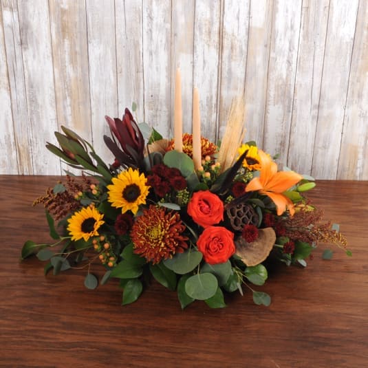 Double Taper Candle Centerpiece Double Taper Candle Centerpiece - This oblong centerpiece comes with two taper candles great for a long table.