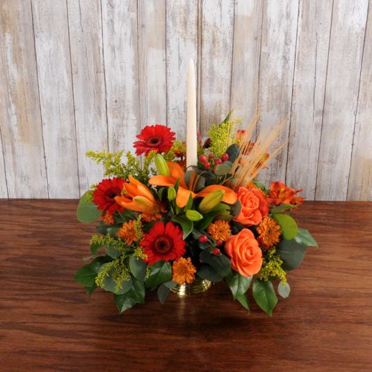 Single Taper Candle Centerpiece Single Taper Candle Centerpiece - This rounded centerpiece comes with a single taper candle perfect for a smaller table.