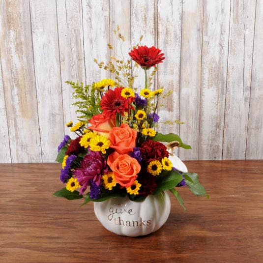 Give Thanks Give Thanks - This white ceramic keepsake pumpkin comes filled with beautiful blooms! Reuse the container year after year.