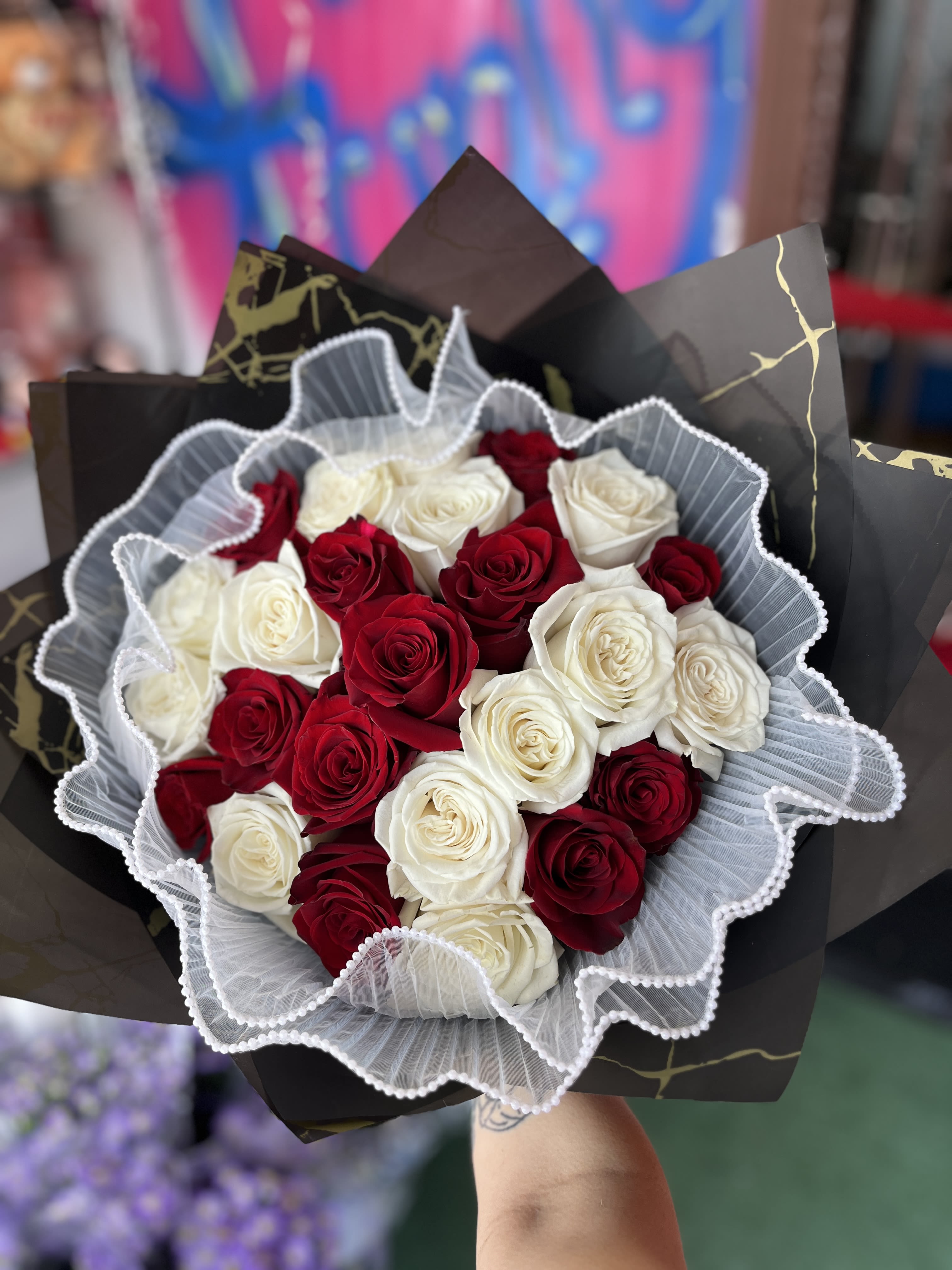 crimson love - averages 24 roses in red and white, with a pearled collar 