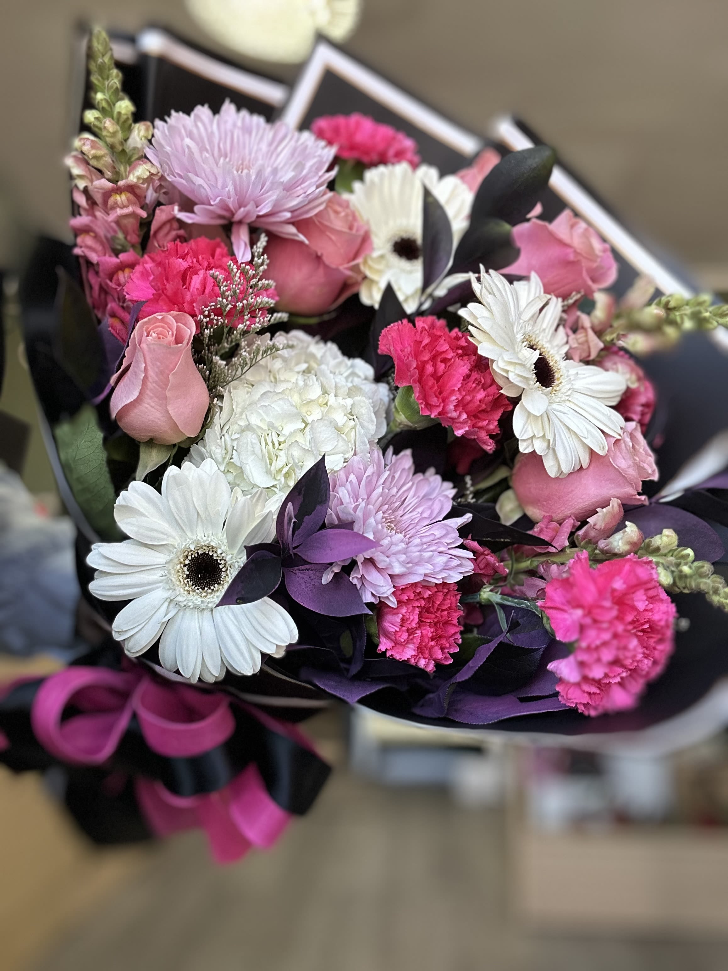 Beautiful in hot pink bouquet  Beautiful in hot pink bouquet  - . These fragrant blooms exude elegance and charm, beautifully wrapped to make a bold statement. Ideal for birthdays, anniversaries, or simply to brighten someone’s day.  *Filler variety and wrapping may differ from photo.    *Please see substitution and delivery policy.