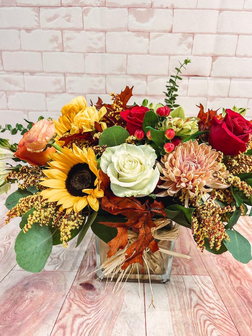 Autumn Bliss   - Autumn blooms and greens especially for fall. This arrangement brings an elegant elevated look to any space. Neutral tones complete with a pop of color. 