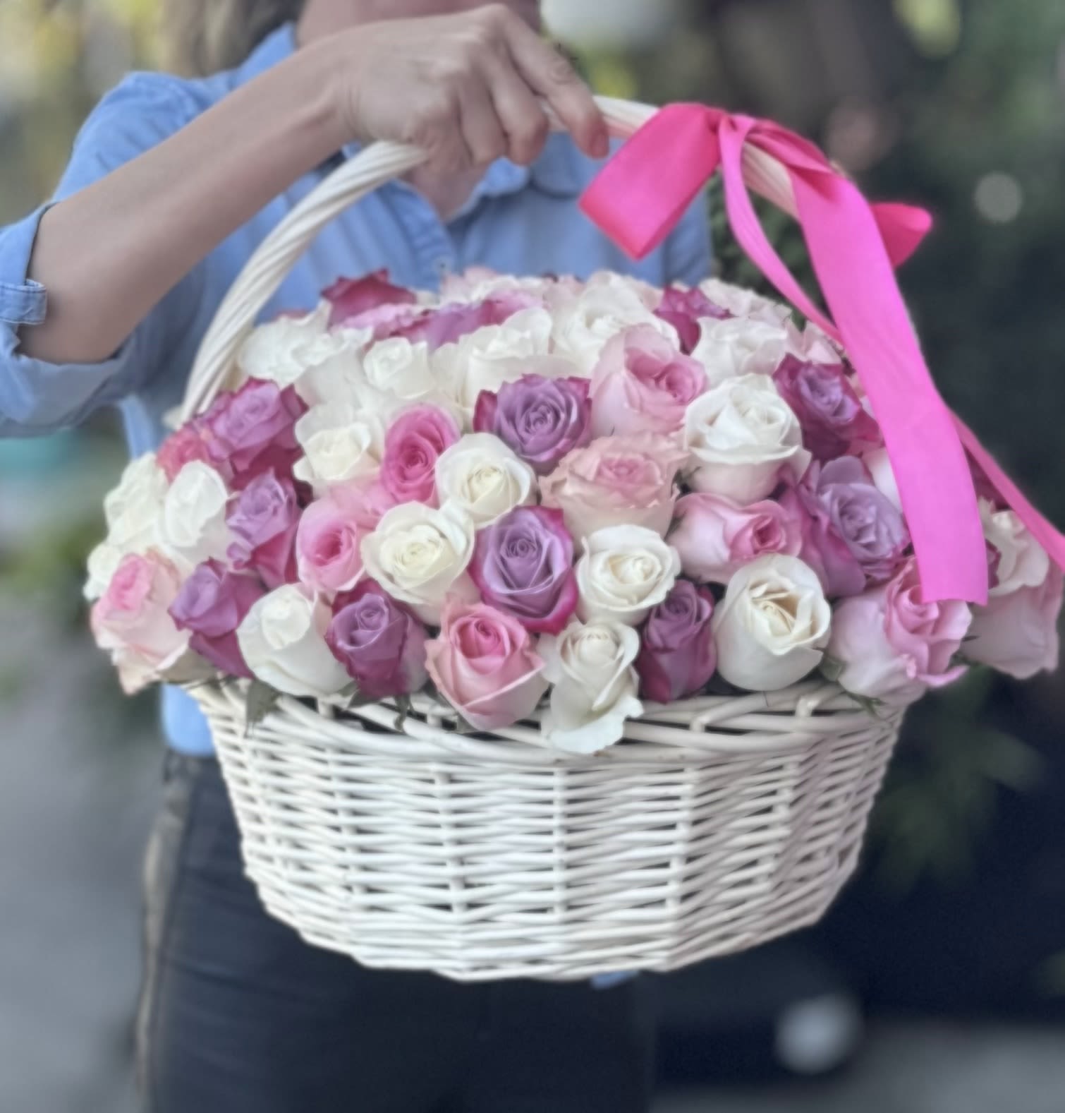 Elegant Rose Basket Elegant Rose Basket - This graceful floral basket is overflowing with premium roses in soft shades of blush pink, dusty lavender, and cream, making it the perfect expression of beauty, love, and celebration. Hand-arranged in a classic white wicker basket and finished with a bold pink satin bow, the design is romantic yet modern – perfect for life’s most meaningful moments. With its full, rounded shape and harmonious blend of pastel tones, this floral arrangement is ideal for Mother’s Day, bridal showers, anniversaries, birthday gifts, or engagement surprises. It also makes a beautiful centerpiece for events or a luxurious gesture “just because.” The soft pinks and purples add depth and elegance, while the white roses offer purity and timeless charm. Whether you’re celebrating someone special or brightening your own space, this floral basket makes a stunning statement with sophistication and grace. Same-day flower delivery available in Los Angeles Customers who loved this design also liked this bouquet: https://lotuseventdecor.com/simi-valley-lotus-event-decor/chic-pink-harmony-flower-arrangement-in-a-box.html