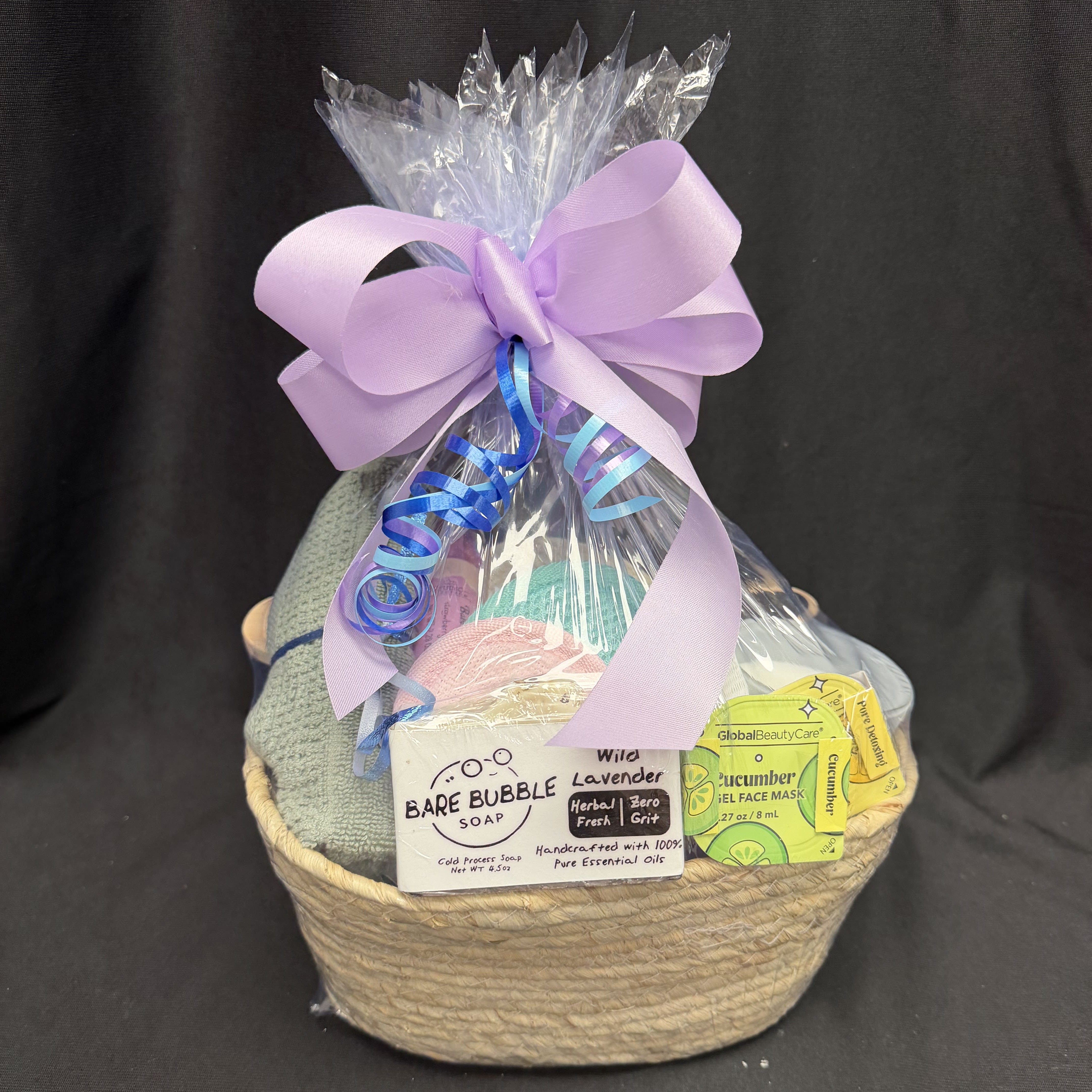 Tranquil Moments Spa Gift Basket - Unwind and indulge in pure relaxation with our Tranquil Moments Spa Gift Basket. This beautifully wrapped set includes handcrafted Bare Bubble Soap made with 100% pure essential oils, a soothing cucumber face mask, a soft spa cloth, and other pampering essentials for a calming self-care experience. Perfect for birthdays, thank-you gifts, or simply treating someone special to a peaceful escape at home.
