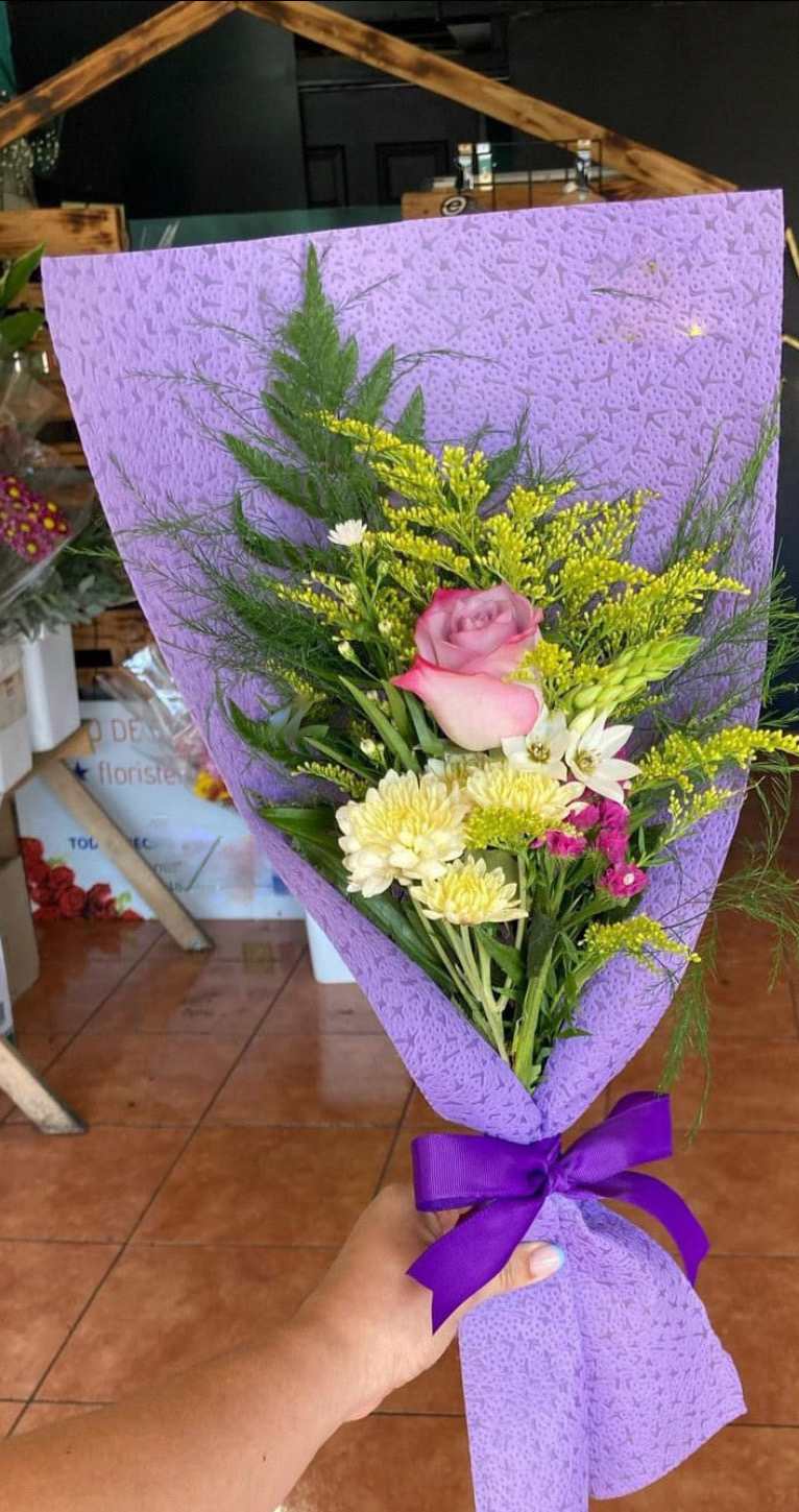 Single Rose Wrapped  - Single Rose ( Choose your color ) Wrapped in a cute color paper with solidago, a stem of mini carnations with a Pom Daisy of a matching color.