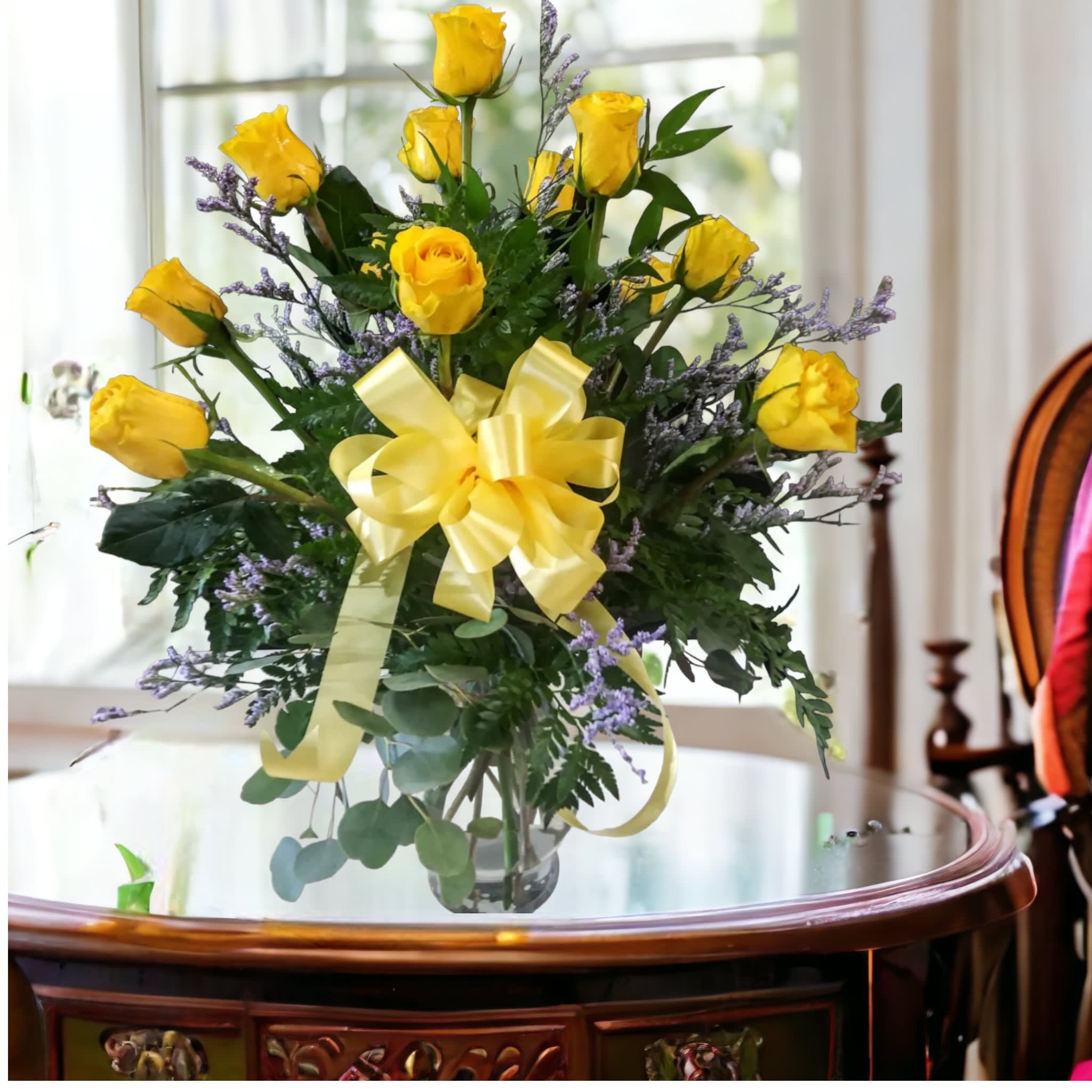 A Dozen of Yellow nothing says friendship like yellow roses - Nothing says friendship like yellow roses. These roses are designed in a clear glass vase with three types of greeneries and Filler. 
