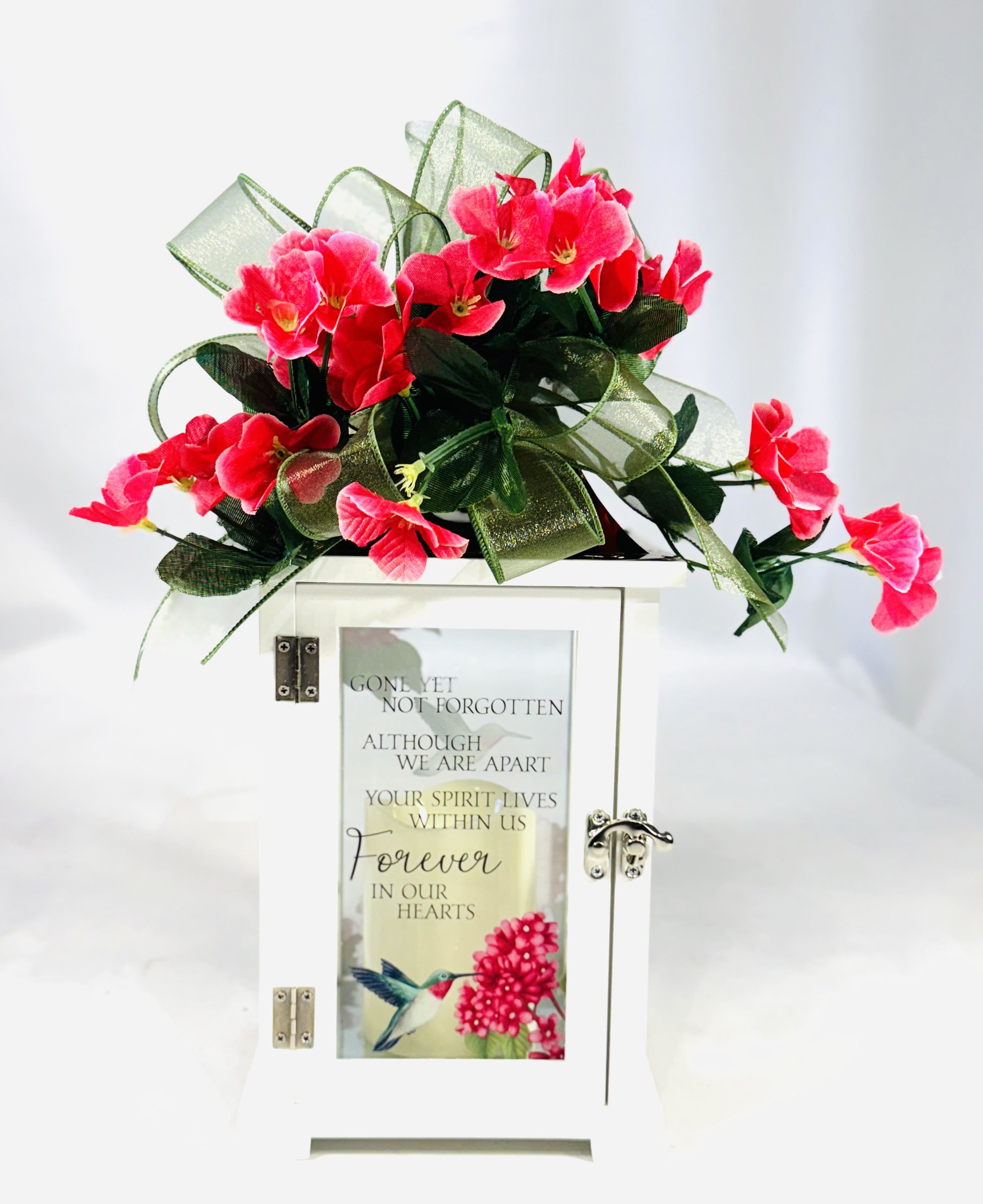 &quot;Forever in Our Hearts&quot; Lighted Sympathy Lantern - Our lanterns are made from quality composite wood and a stainless steel copper finish top. They feature a built-in automatic timer which runs for 6 hours on and 18 hours off(3-AAA batteries are included) and are inscribed with sentimental quotes. Suitable for hanging or free-standing use inside.   Each memory lantern is inscribed with the sentimental sympathy quote:  &quot;Gone yet not forgotten, although we are apart.   Your spirit lives within us, forever in our hearts.&quot; W: 6.25&quot; H: 13.5&quot; D: 6.25&quot;