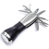 10 Function Flashlight Survival Tool - Distinctive Mad Man flashlight with several hidden tools in the handle. Great for the man on the go! Tools include scissors, saw blade, and knife. Stainless steel with matte black contrast The ideal men's accessory for home and car. Material: Stainless Steel | Plastic Dimensions: 6" x 2.5" https://youtu.be/vXcr8uGvyQM