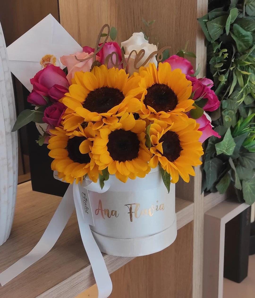 Sunshine Bloom Box – Sunflower and Mixed Rose Arrangement | Radiant Gift in Orange County - Bring joy and color to any occasion with our Sunshine Bloom Box, a beautiful floral arrangement featuring fresh sunflowers and roses in varying shades, designed in an elegant box that highlights their natural beauty. Every detail is designed to convey positive energy, love, and gratitude, making it the perfect gift for birthdays, thank yous, or simply to brighten someone's day.  Available for delivery in Orange County, California (Placentia, Fullerton, Brea, Anaheim, and surrounding areas).