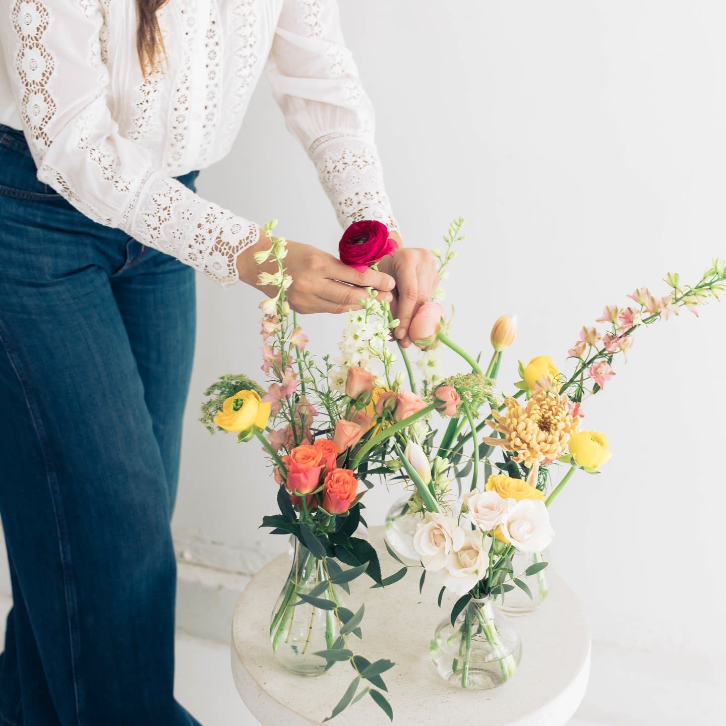 Bud Vases (5) - Choose your favorite color palette: Bright Neutral Pastels Includes (5) clear glass vases.  Lovely mix of unique blooms in Aquarela’s signature style. Blooms and palette may vary, but you’ll receive a fresh, artfully designed arrangement, approximately 12” in size.