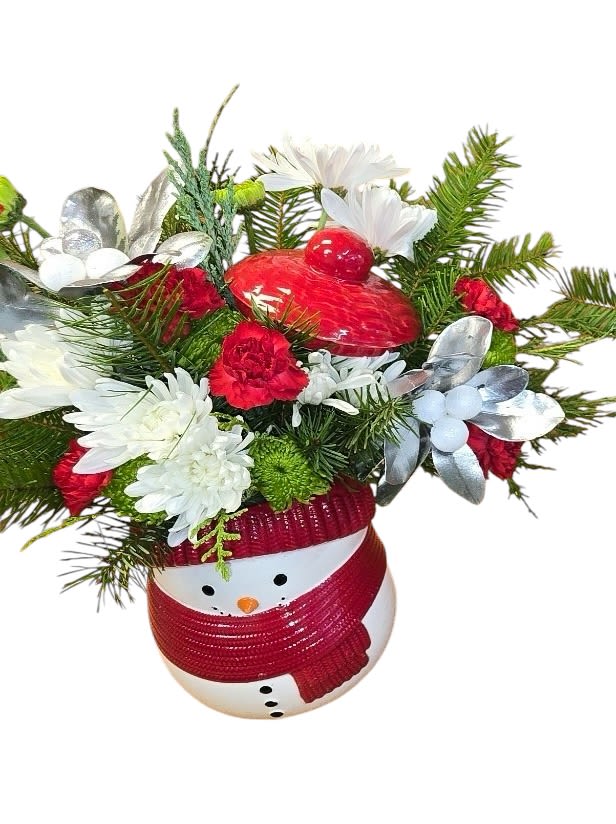 FROSTY WISHES FROSTY WISHES - Whether it's filled with festive Christmas flowers or sweet treats, this cheerful frosty snowman treat jar vase brings whimsical winter cheer and joy to your loved one's face. The Frosty Wishes Bouquet includes miniature red carnations, green button spray chrysanthemums, and white cushion spray chrysanthemums, accented with variegated holly, white pine, and noble fir. It is beautifully presented in the Frosty Wishes Treat Jar, adding festive charm to any occasion.