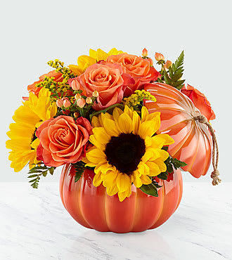 Pumpkin Pumpkin - Our Harvest Traditions ceramic pumpkin vase has a stem and jute handle that can be reused all season long; it is filled with a collection of truly gorgeous blooms. Comprised of an array of orange roses, bold sunflowers and peach hypericum berries, this arrangement is sure to add a flare of harvest delight to any room.