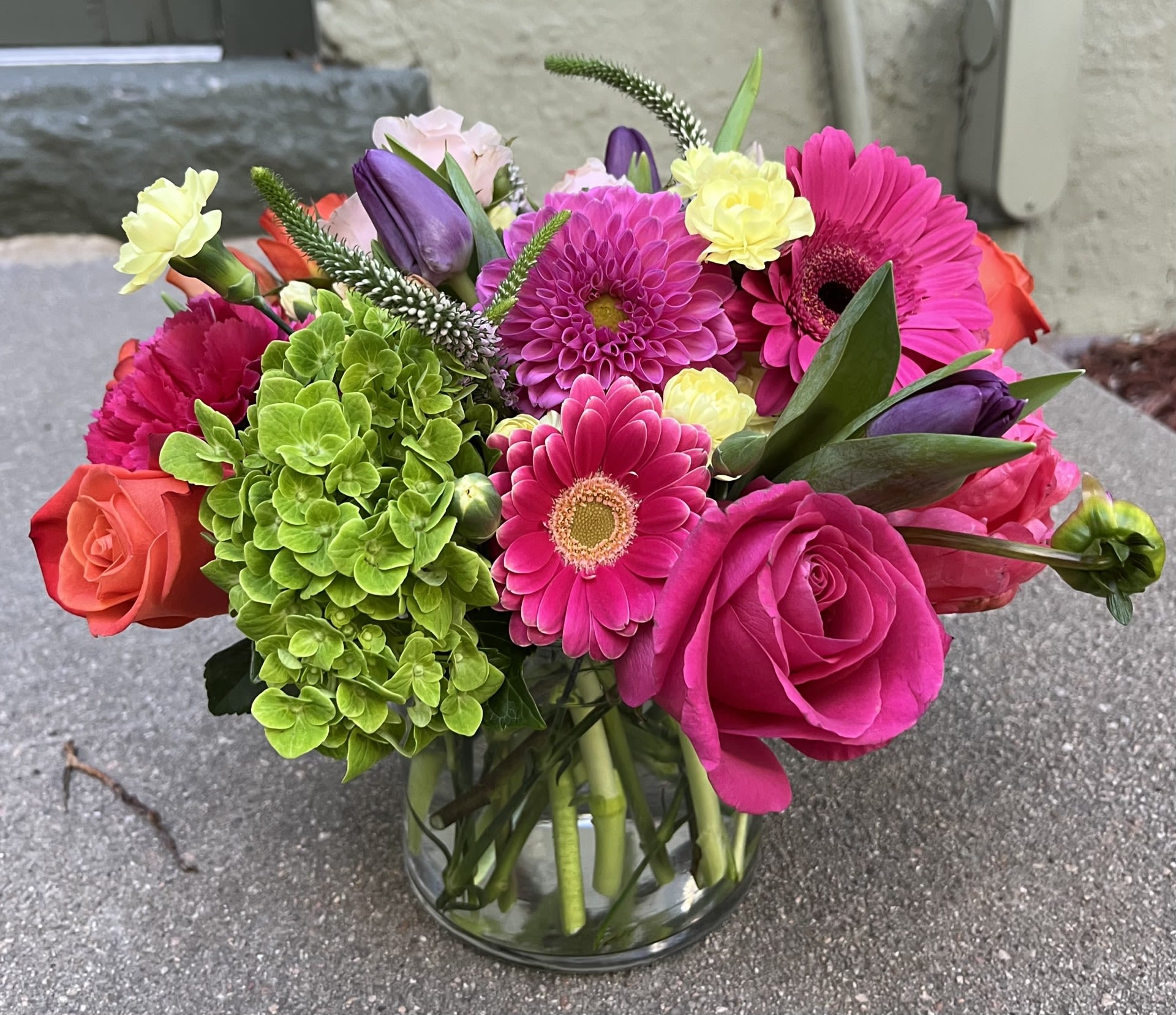 In My Garden In My Garden - This garden style arrangement includes gerbera daisies, roses, tulips, and seasonal blooms. This is a great gift for a birthday or Mother's Day. Denver Florist, LoHi Florist. Same Day Delivery if ordered before Noon Mountain Time.