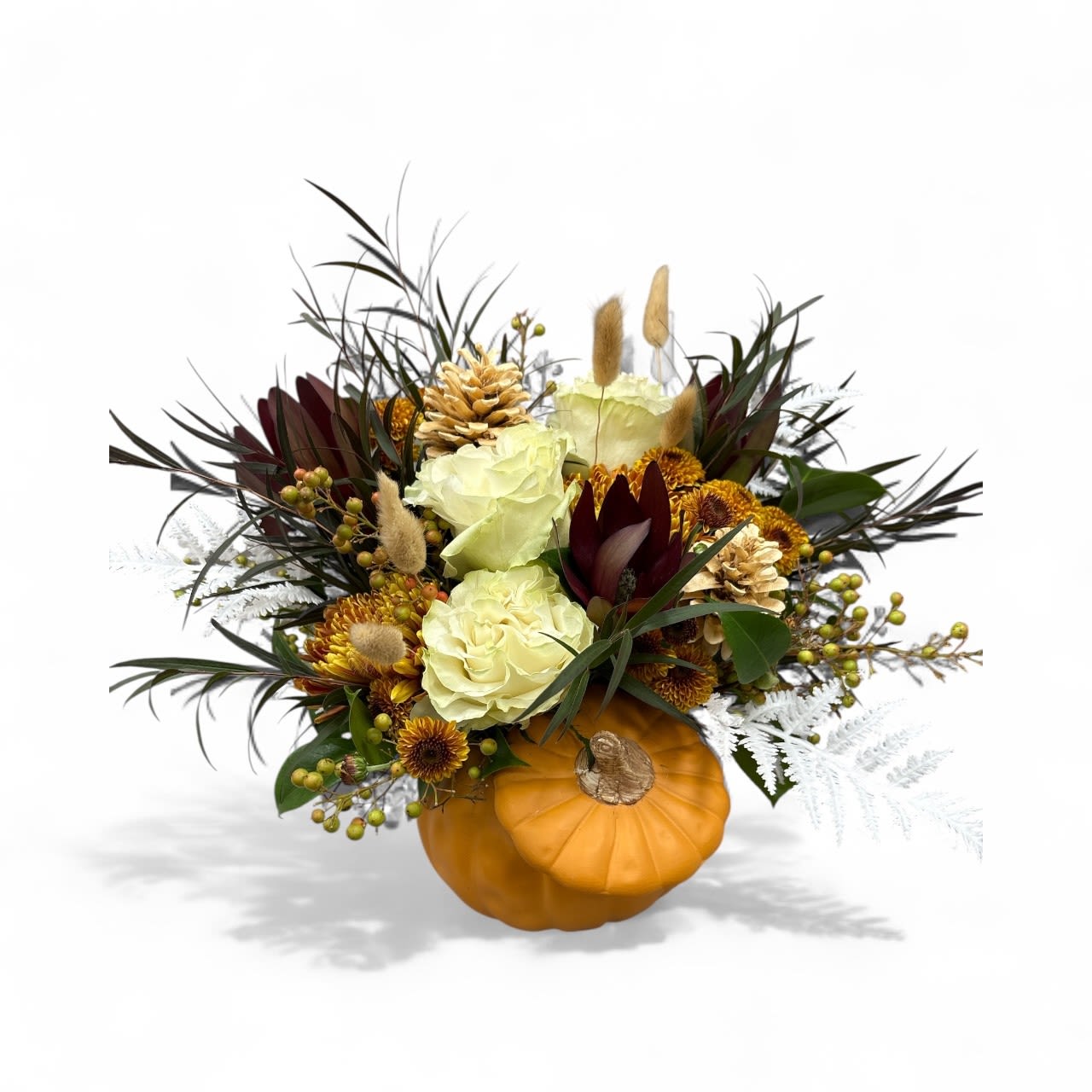 Porcelain Pumpkin Porcelain Pumpkin - This lovely cream white ceramic pumpkin is bursting with everything fall from seasonal mums to silk autumn leaves. A perfect way to welcome the season or display as a centerpiece on your table