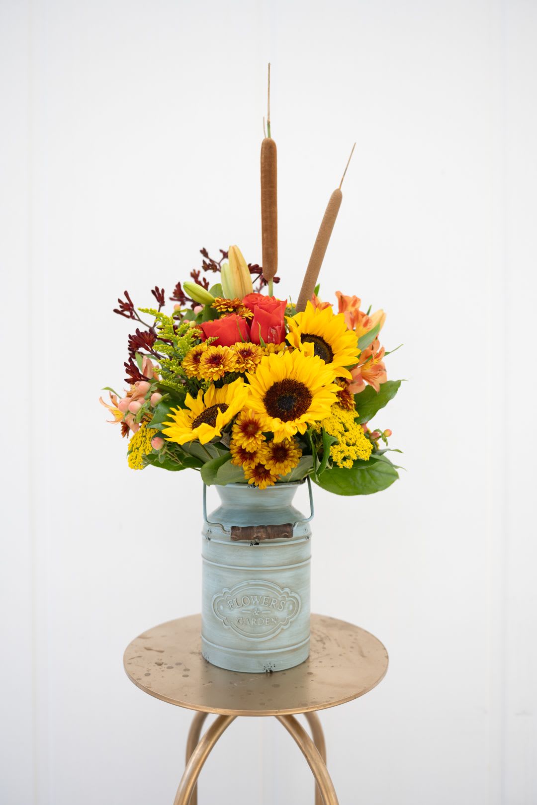 COUNTRY FALL - Mixed fall flowers in a milk jug.  Perfect for the fall. 