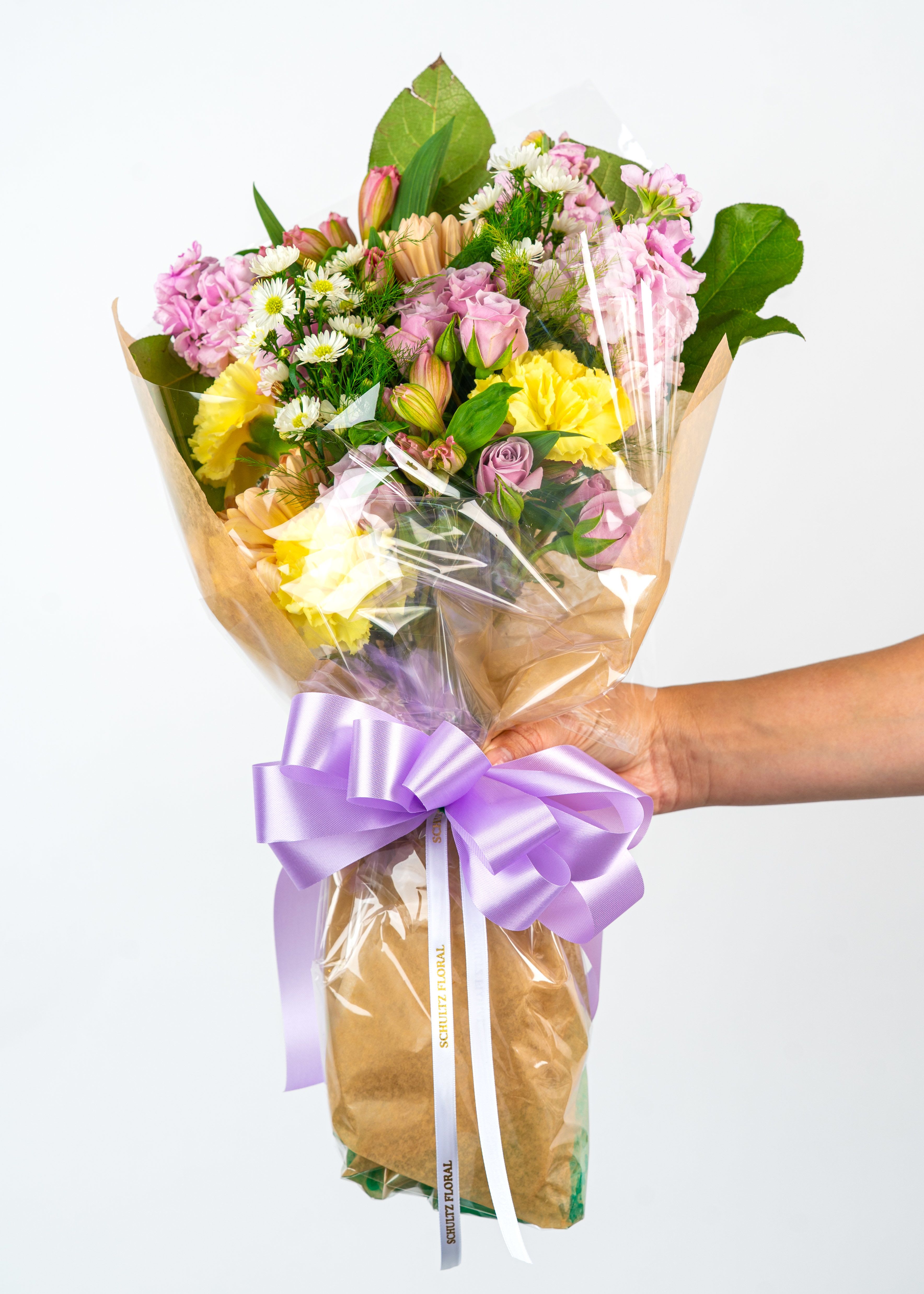 Birthday Surprise Bouquet - Let our florist express your cherished love, friendship, and more with a birthday bouquet based on our best premium blooms. At Schultz Floral, each bouquet is one of a kind and styled just for your order. Because we always use the freshest blooms, your final bouquet may not look exactly as pictured due to seasonal availability. Rather, a Birthday Surprise Bouquet is intended to celebrate creativity and artful color combinations. Happy Birthday!  This is a top seller in Valparaiso, Chesterton, and South Haven (Indiana).