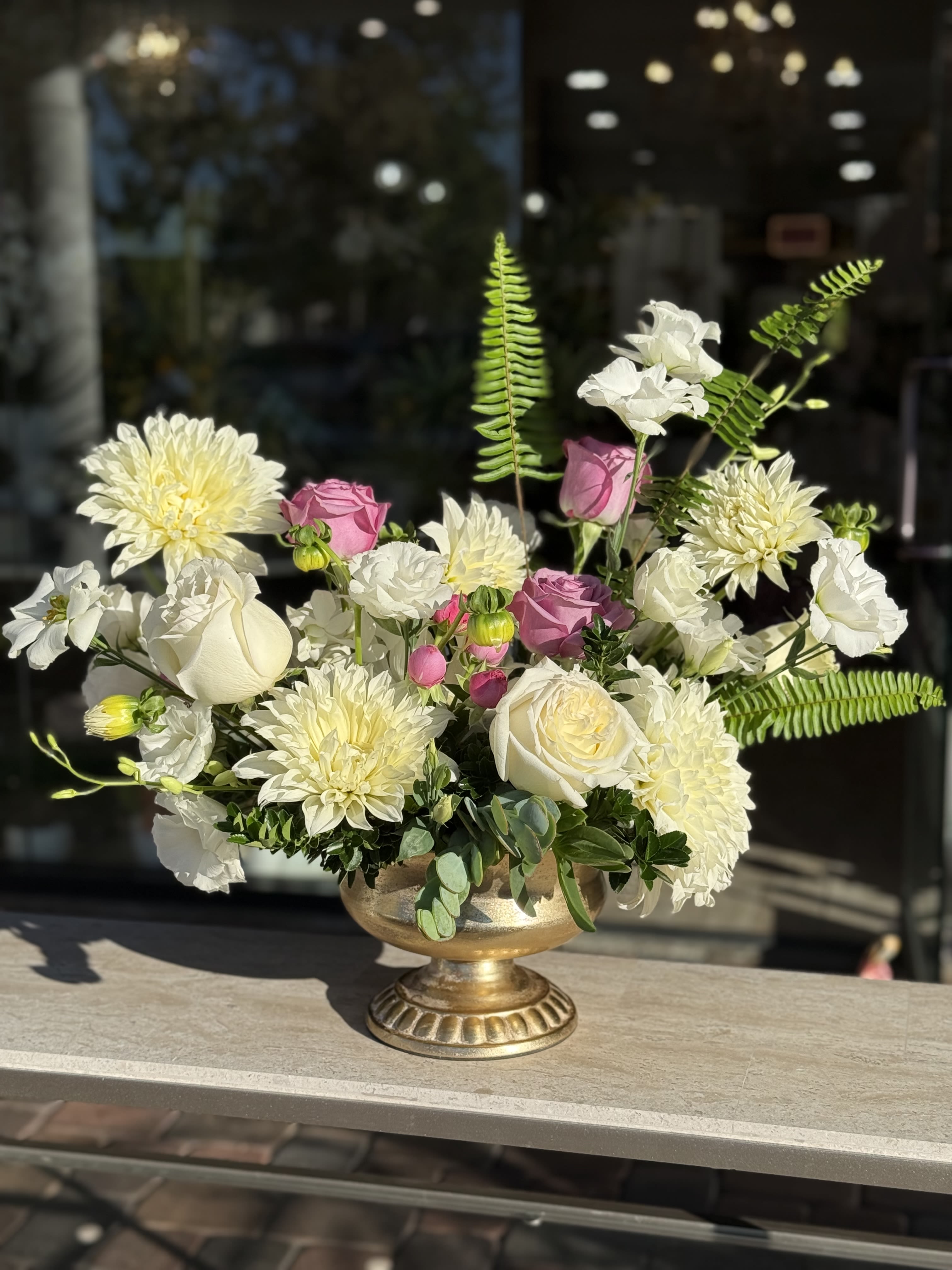 Soft touch of Lavender  Soft touch of Lavender  - Beautifully arranged florals with roses, Dahlias and more in gorgeous urn vase