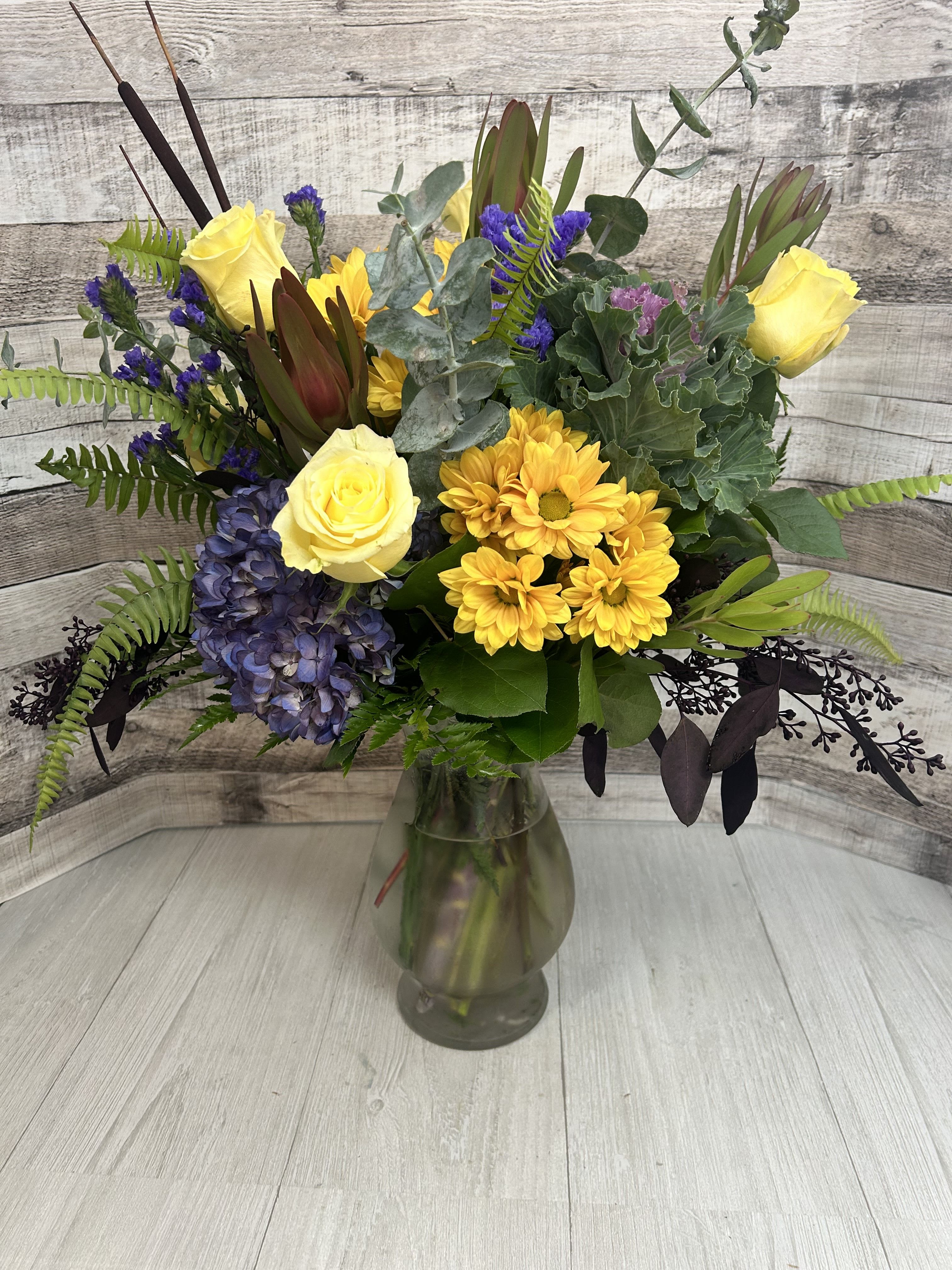 Cool Auumn Breeze - Crisp colors of this refreshing reflection of beauty will brighten any day.  With wisps of eucalyptus,  stunning kale and bursts of yellow, any spirit can be lifted and a smile brought to their face.  