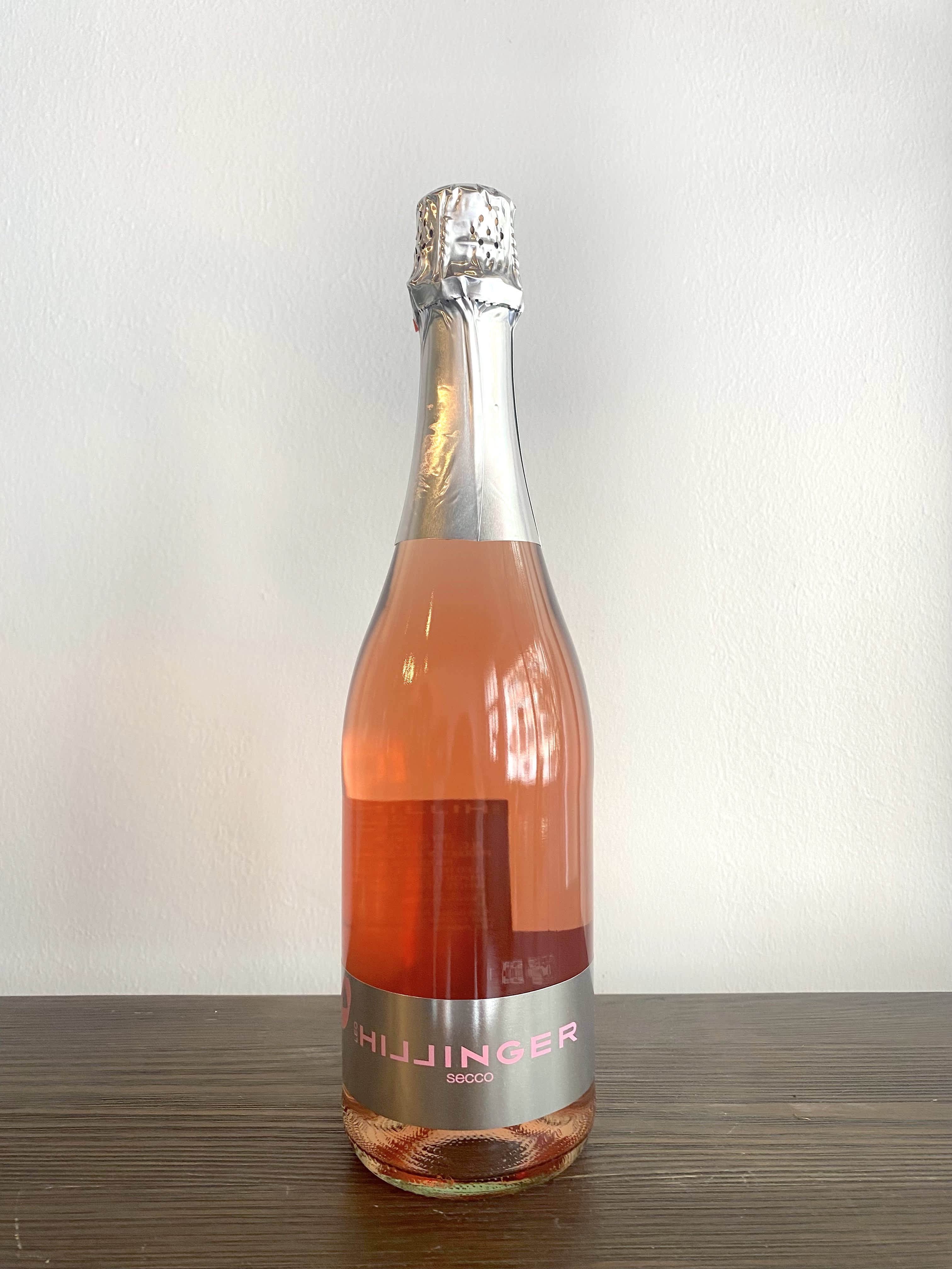 &quot;Hillinger Secco&quot; - Sparkling Rosé - 100% Pinot Noir crafted into a sparkling rose wine made in the Prosecco style. It has delicate aromas of fresh strawberries and red berries, which follow through on the palate. The flavors are beautifully balanced with a vibrant and refreshingly dry finish.  Flower Pairing Suggestion - Blush Collection or Rose Tea   750 mL bottle, 12% alcohol 
