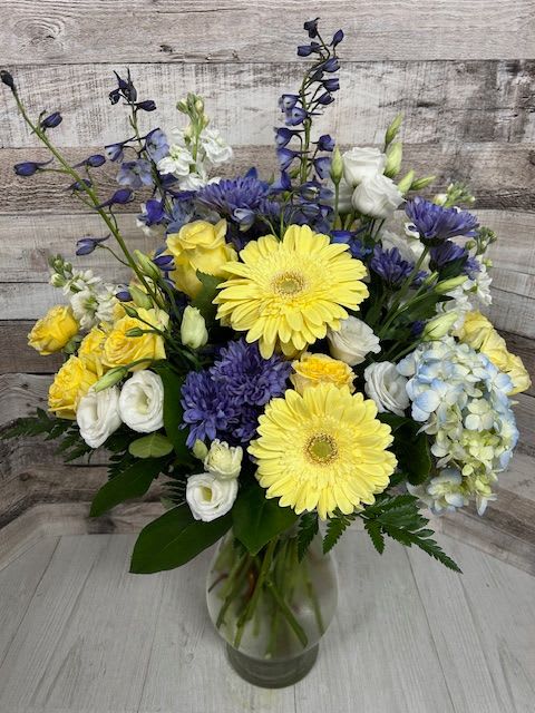 Blue Senstation - This arrangement could be called an &quot;a timeless muse&quot; Looking for a springtime arrangement that will be a show stopper? Send someone special this stunning piece for them to be in awe. 
