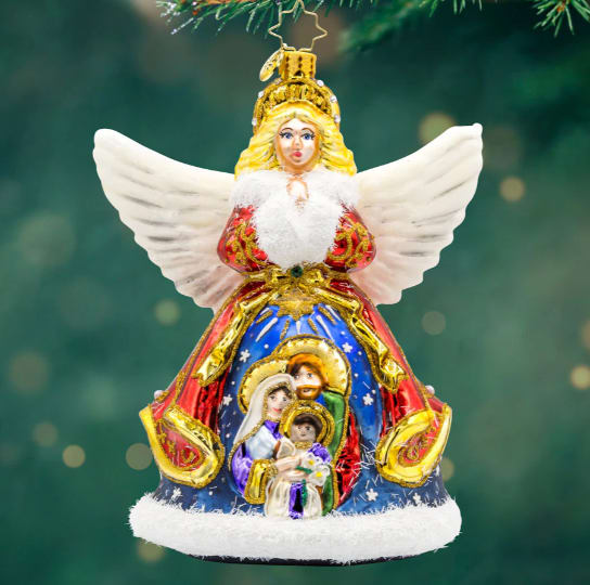 Radko Nativity Guardian Radko Nativity Guardian - 2025 Radko: Watch over your holiday season with Nativity Guardian! This angelic figurine features a beautiful nativity scene on her coat, bringing a touch of heavenly peace to your home.