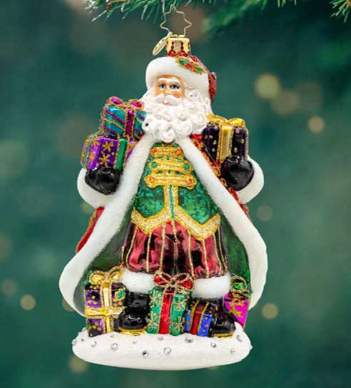 Radko Santa for All Seasons Radko Santa for All Seasons - Celebrate 25 years of Christmas magic with our veteran Designer, Joe Walden's piece A Santa For All Seasons. This festive piece features a jolly Santa Claus adorned with shimmering gold glitter, sparkling gems, and a luxurious satin coat. His sleigh is filled with presents, ready to be delivered to children around the world.