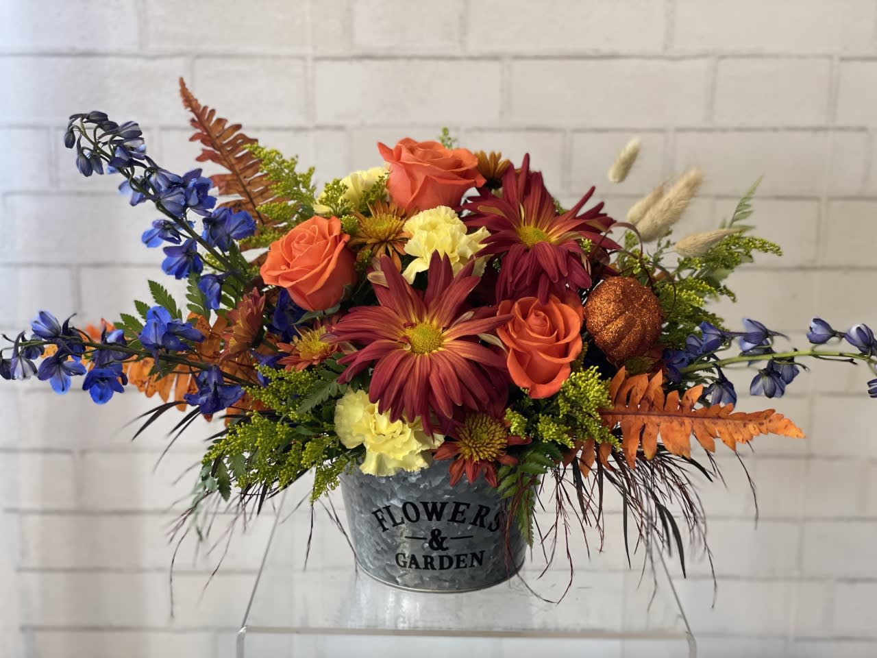 Autumn Garden Autumn Garden - An autumn garden arrangement captures the rich, earthy beauty of the season with a warm and textured palette the arrangement evokes the cozy nostalgia of autumn