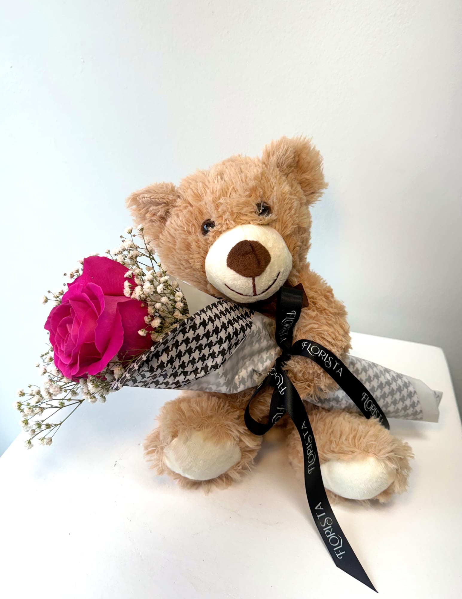 BEAR HUG BLOOMS - The perfect way to show just how proud you are of someone! This adorable gift includes a cuddly teddy bear hugging a small bouquet arrangement, including a beautiful single stem rose! 