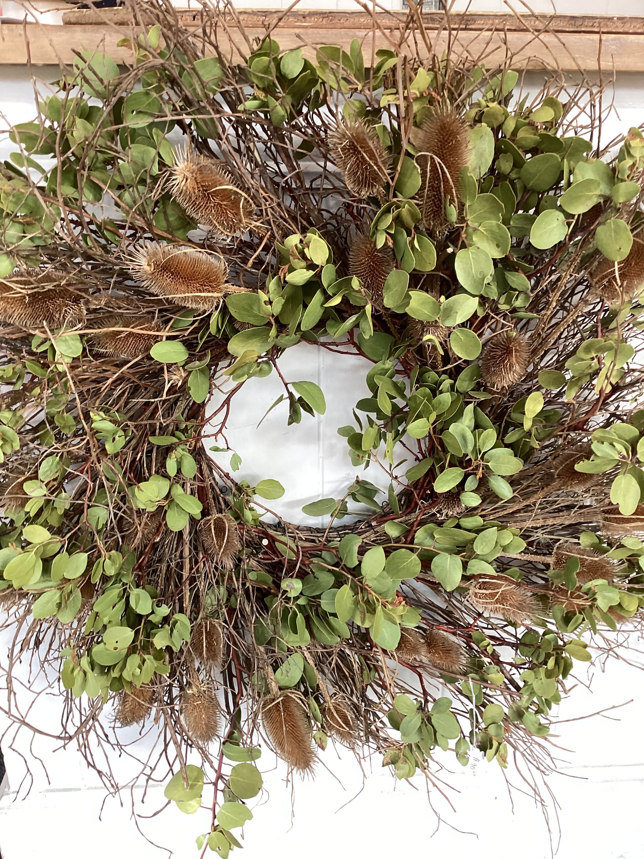 Wreath of Distinction Wreath of Distinction - A wreath of natural dried manzanita, pods and twigs. 26" round symbolizing unity and hospitality. Perfect for indoor or outdoor (under cover).