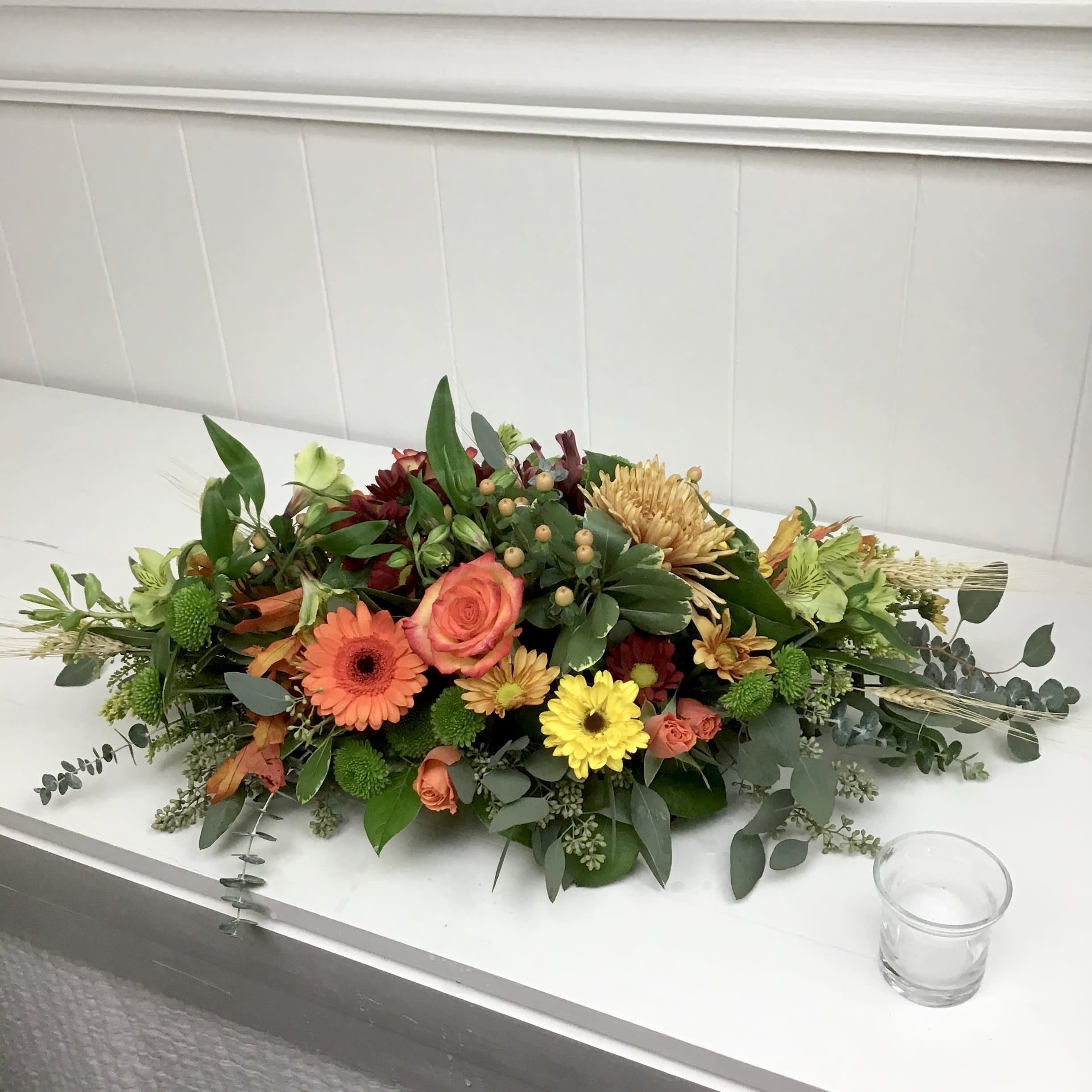 Fall Centerpiece Fall Centerpiece - Festive fall centerpiece, perfect for any occasion this autumn! The fall mums that are used may differ from the picture, we will ensure that we use a variety of fall poms, green kermits, and other seasonal flowers.