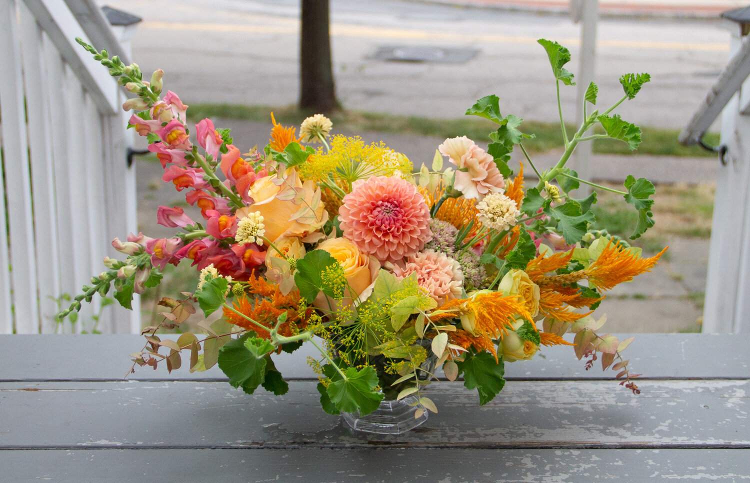 Custom One of a Kind Organic Compote - This arrangement is sure to make a special statement! Each arrangement is hand crafted by our florists to create a free spirited and artistic arrangement full of lush greenery and a variety of premium blooms and textures in a footed compote vase. Please leave a note or call to discuss any color preferences, otherwise our designers will choose the color palette based on the freshest blooms we have in stock! Vase is available in clear or painted copper or gold, let us know if you have a preference