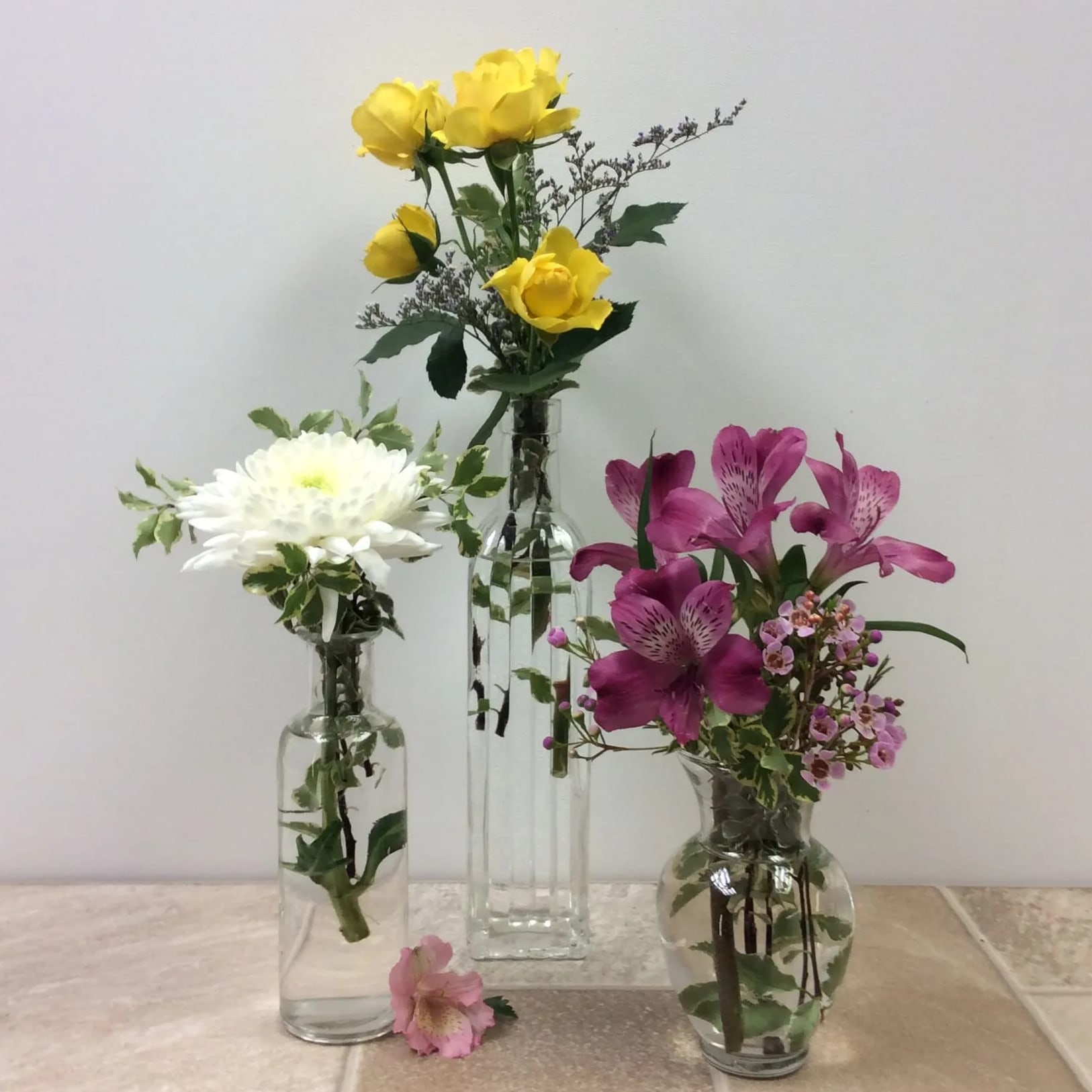 Elsie Elsie - Vintage vase trio. Three different small glass vases filled with seasonal fresh flowers.