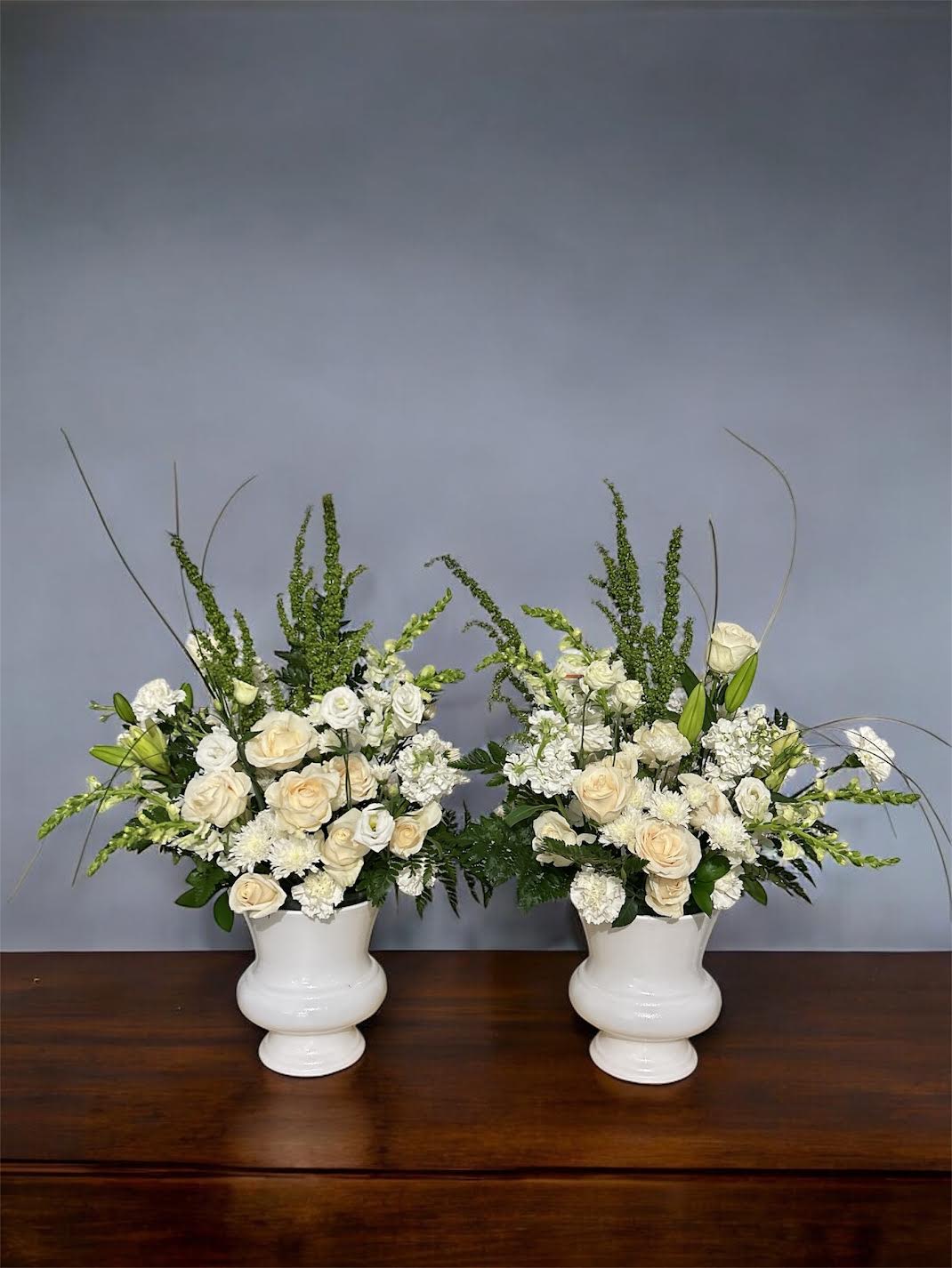 Funeral Flowers- [Flower Basket] 1 - -A traditional one-sided piece specifically made for funeral viewings -Placed on the floor at or near the front of the room during viewings -Approximate size: 30&quot; Tall  Substitutions of flowers and/or containers happen due to inventory availability, weather, seasonality, and even market conditions. We always strive to ensure that the style, theme, and color scheme of your arrangement is preserved and will only substitute items of equal or higher value.