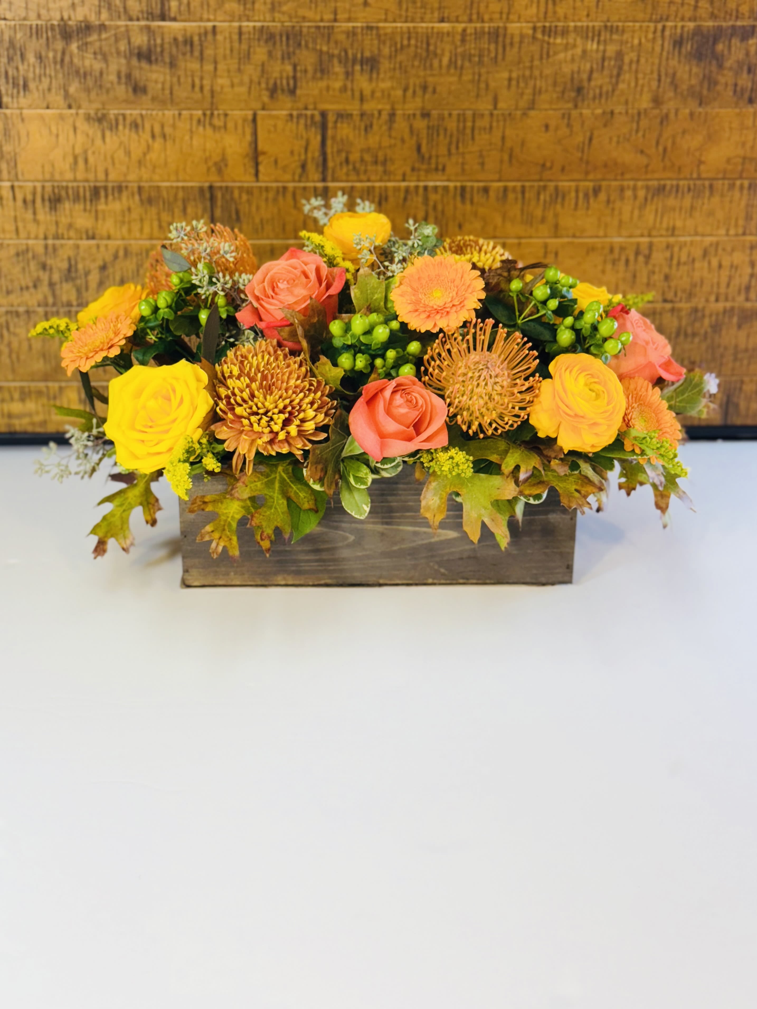Box of Autumn Box of Autumn - Wouldn’t life be more convenient if seasons came in boxes? We already have boxed wine, boxed lunches, and boxing matches. Seasons need to catch up. Now they have. Introducing the Box of Autumn by Vanessa. Whoever you’re sending this to will smile with seasonal joy upon receiving this abundant box of seasonal blooms.