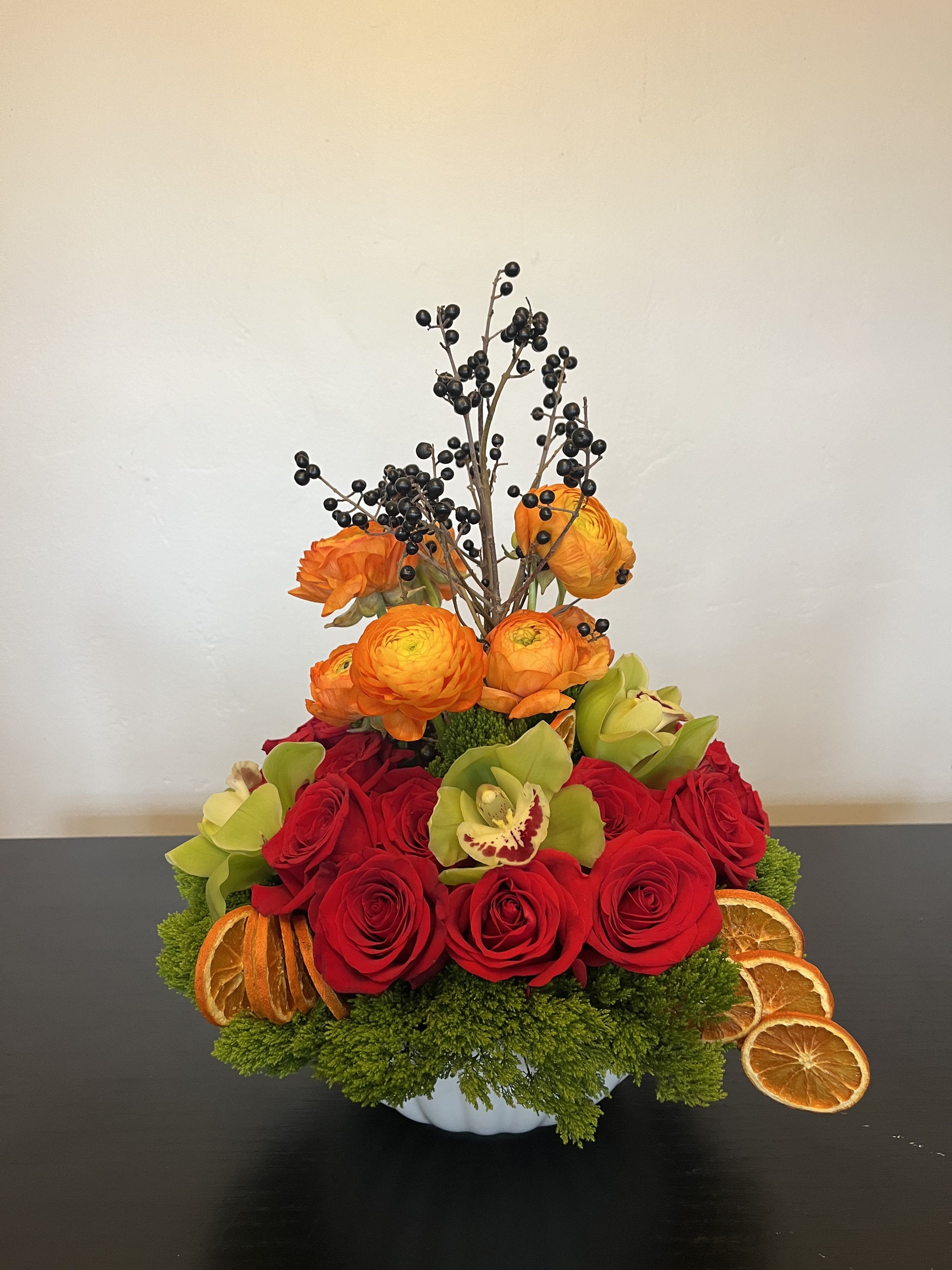 Orange you glad - red roses mixed with bright orange ranunculus with a hint of citrus perfect for brunch  