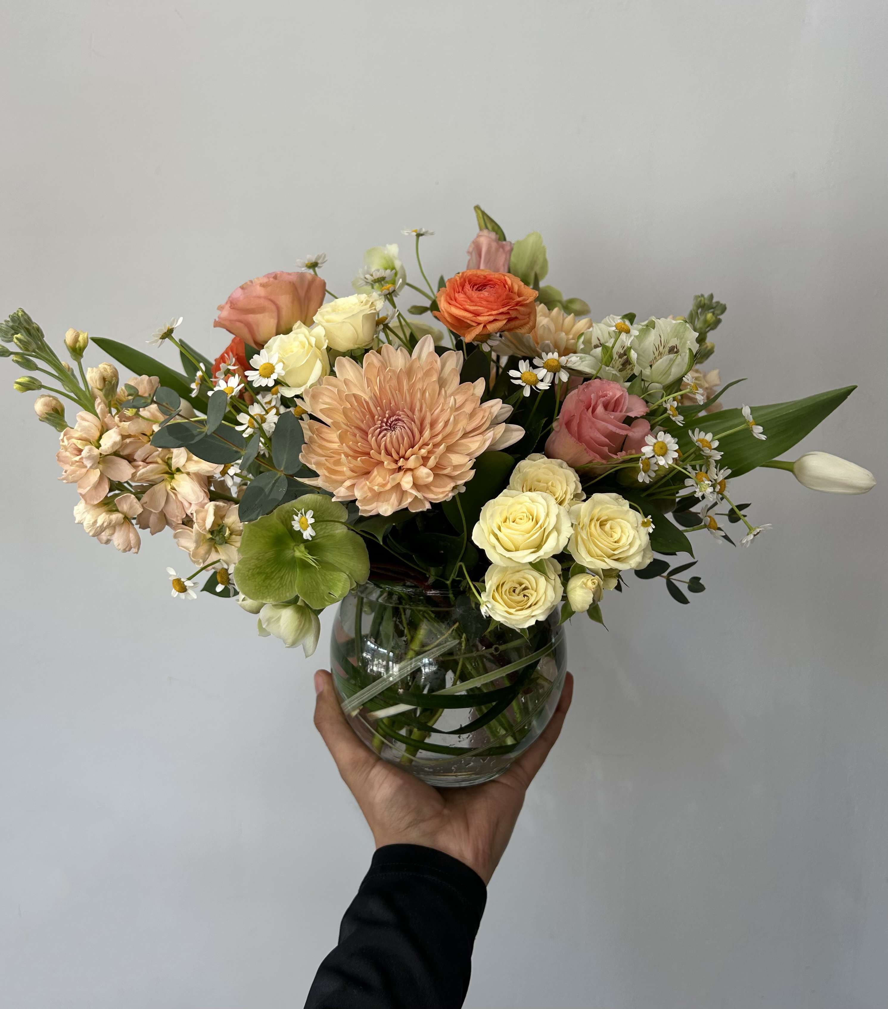 Dusty Coral - Seasonal pastel flowers arranged in a vase. 