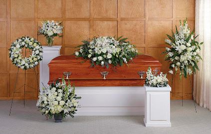 Grandest Glory Collection ( 2 Day Min Before Service) - Inspire your loved ones with peace and serenity with this grand assortment of six hand-made sympathy pieces, featuring pure white roses and lilies.  The Grandest Glory Collection includes the following six sympathy set pieces: Grandest Glory Casket Spray, Heartfelt Sympathy Spray, Serenity Wreath, True Horizon Bouquet DX, Divine Peace Bouquet, Dreams From The Heart Bouquet DX
