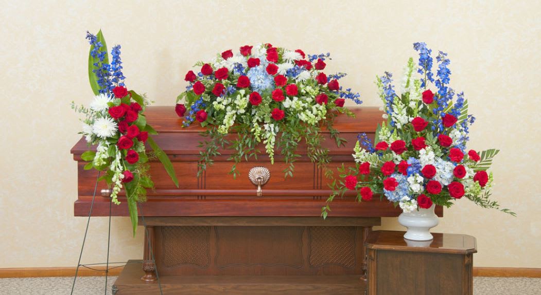 Beautiful Honor Funeral Flowers Set  ( 2 Day Min Before Service) - Beautiful Honor Funeral Flowers Set includes: red, white and blue casket spray, sympathy urn and standing wreath This beautiful red, white and blue set of flowers gives tribute to the one who served with honor.