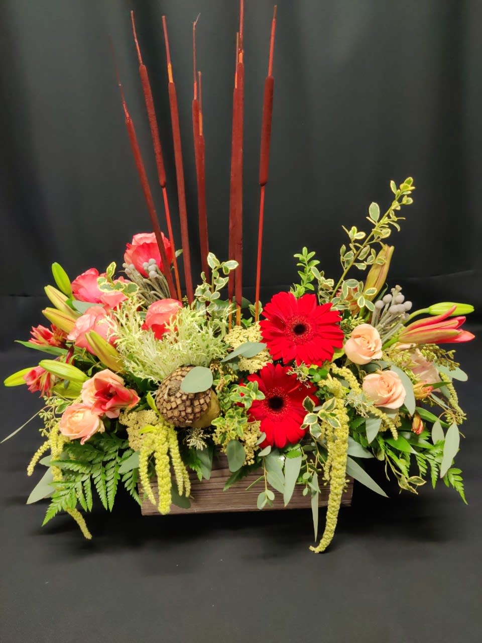 Fall Rose box with Cattails, Deluxe - Rustic box of fall flowers and roses.  Colors and items will vary. Cattails up top make this a super fun arrangement  that makes any tabletop festive. 