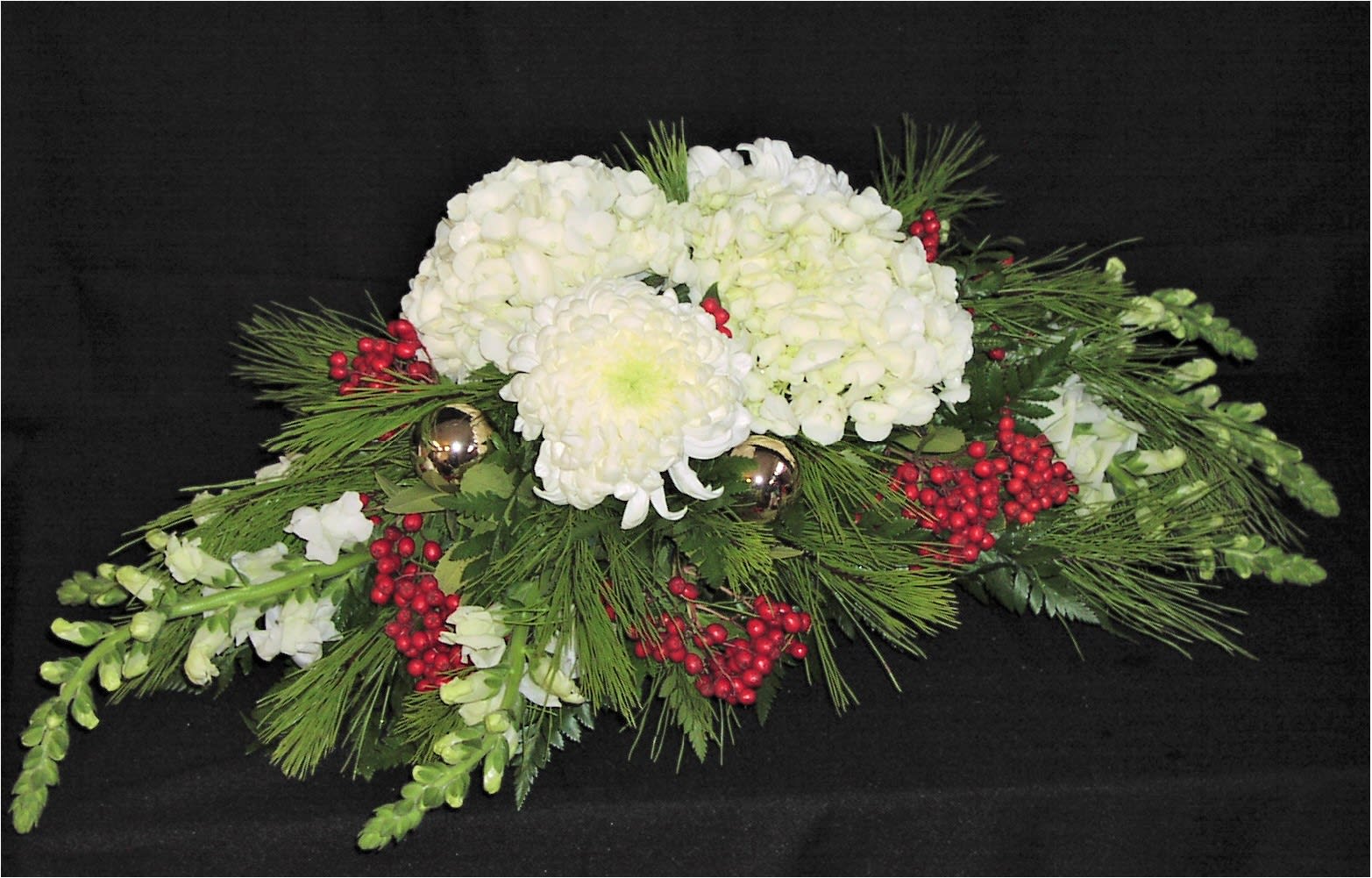 Centerpiece Christmas Centerpiece Christmas - Creamy dreamy hydrangea and football mums perched on top of a low dining table or mantle centerpiece make a splendid gift during Christmas.* We include ornaments and berries and Christmas greens.