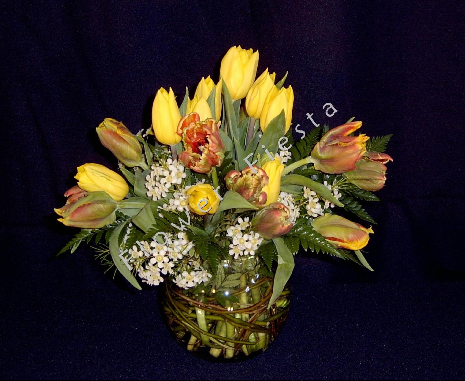 Local tulip mix in willow bowl with fringe or double tulips included Local tulip mix in willow bowl with fringe or double tulips included - An assortment of 15 local grown tulips arranged with greenery and premium filler flowers in a glass vase woven with willow branches. Sweet mother's day gift! Order early for custom color choices. Our most popular Mother's day bouquet so ORDER EARLY as we sell out of tulips early