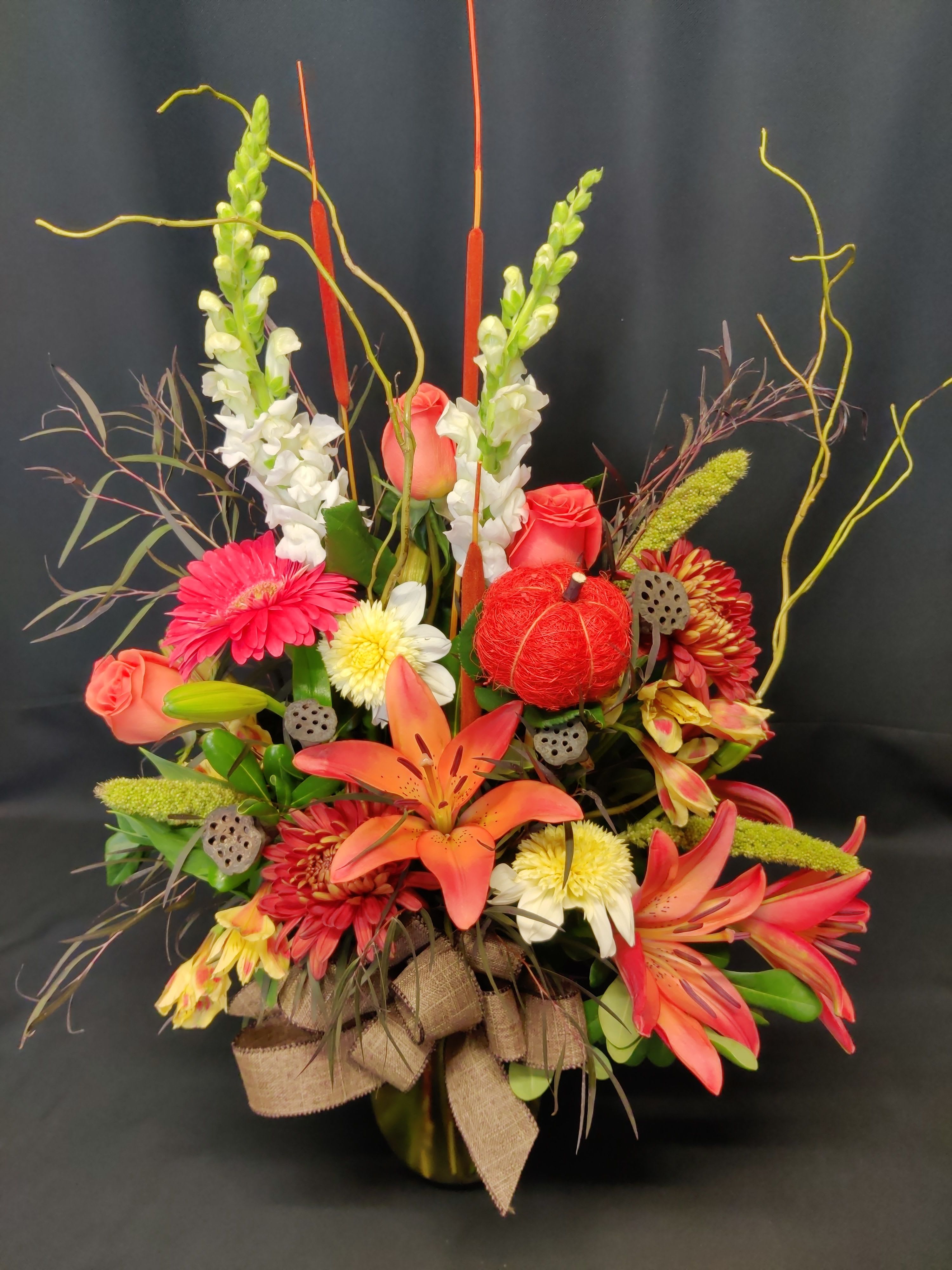 Lily autumn bouquet with cattails Lily autumn bouquet with cattails - Glorious fall color, exact flowers, colors and items may vary.