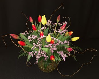 Local mixed tulip willow bowl with branches Local mixed tulip willow bowl with branches - An assortment of 15 locally grown spring tulips arranged with greenery and premium accent flowers in a glass bubble vase woven with willow branches. Also incorporates some whimsical curly willow Branches throughout. Sweet anniversary gift! For more romantic bouquets, see our Roses page