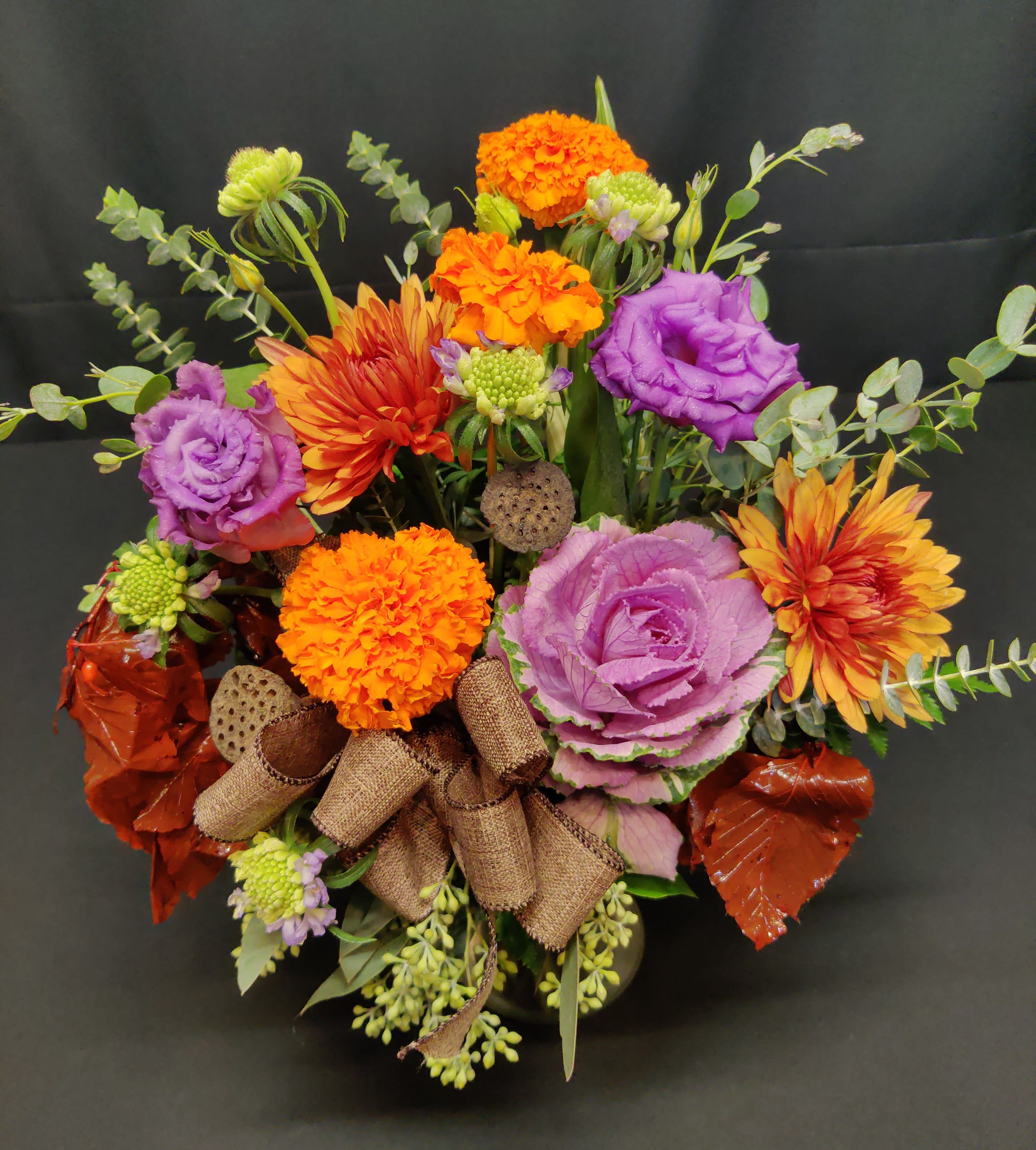Small fall mix with kale - Make someone's fall day complete with this brilliant mixture. Sweet premium and seasonal flowers and accents.  Items will vary based on availability.