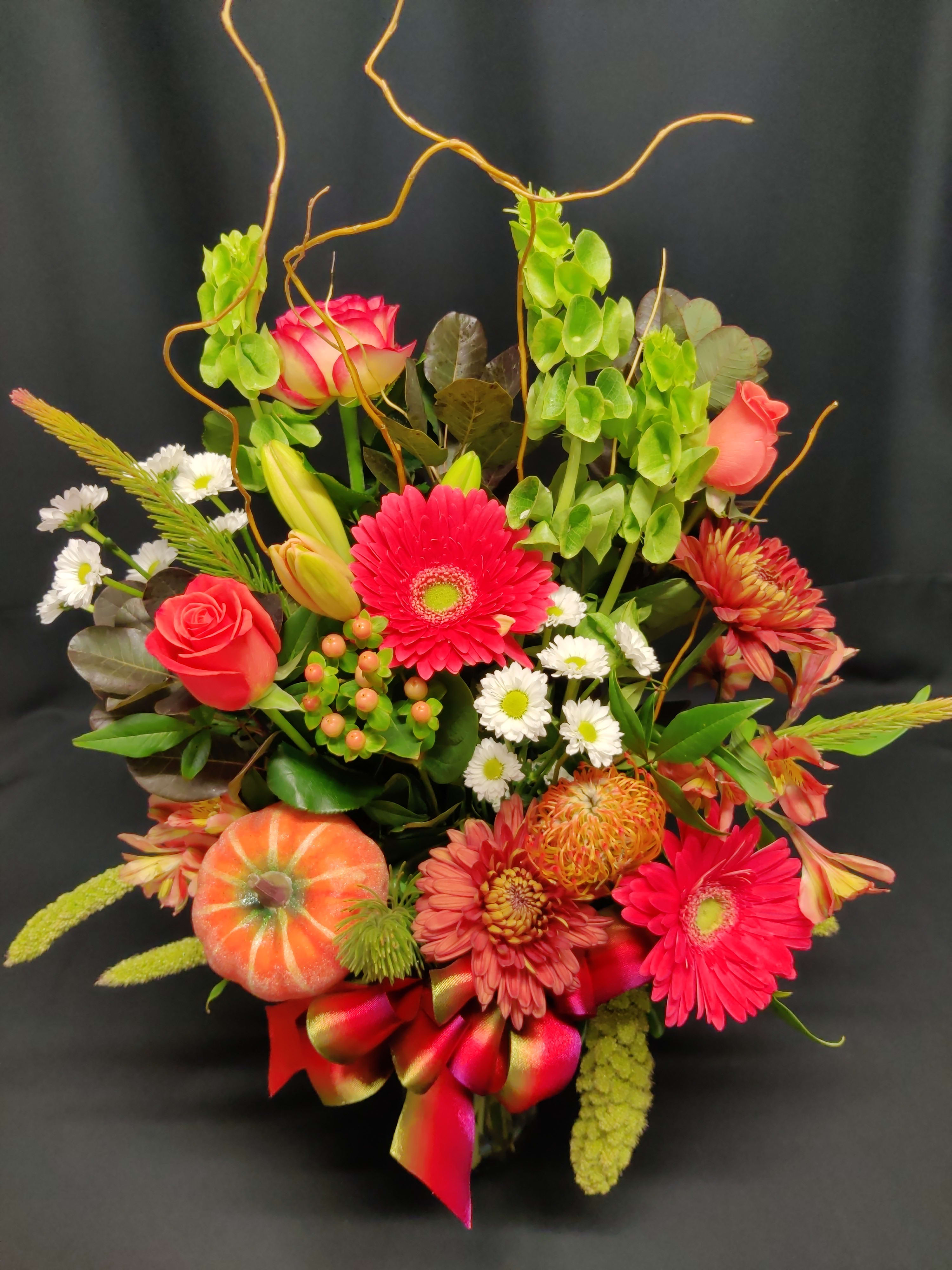 Small daisy mix fall bouquet Small daisy mix fall bouquet - Rich color for fall. Some roses and lovely autumn flowers in a nice contrast of color. Light accent of branches. Flowers and colors will vary.